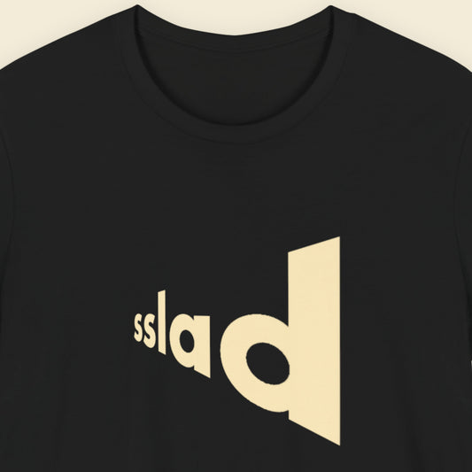 Black t-shirt with humorous text on a beige background.