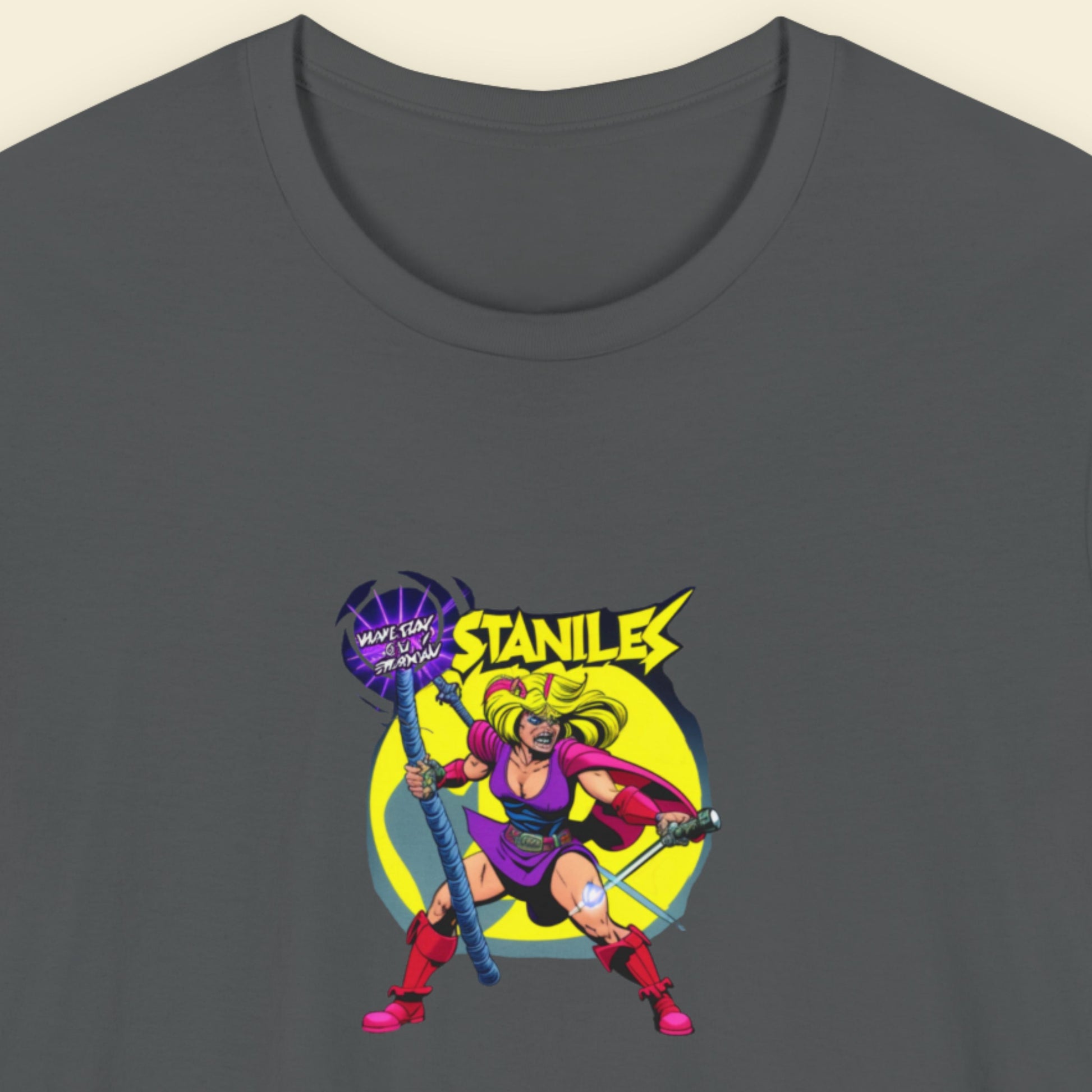 Grey t-shirt with a fun, 80's inspired colorful cartoon illustration on a beige background.