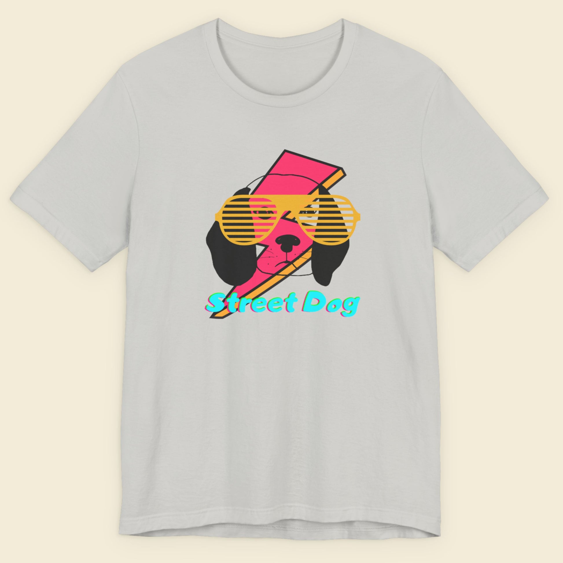 Gray t-shirt with a colorful graphic of a dog wearing sunglasses and the text 'Street Dog' on a beige background.