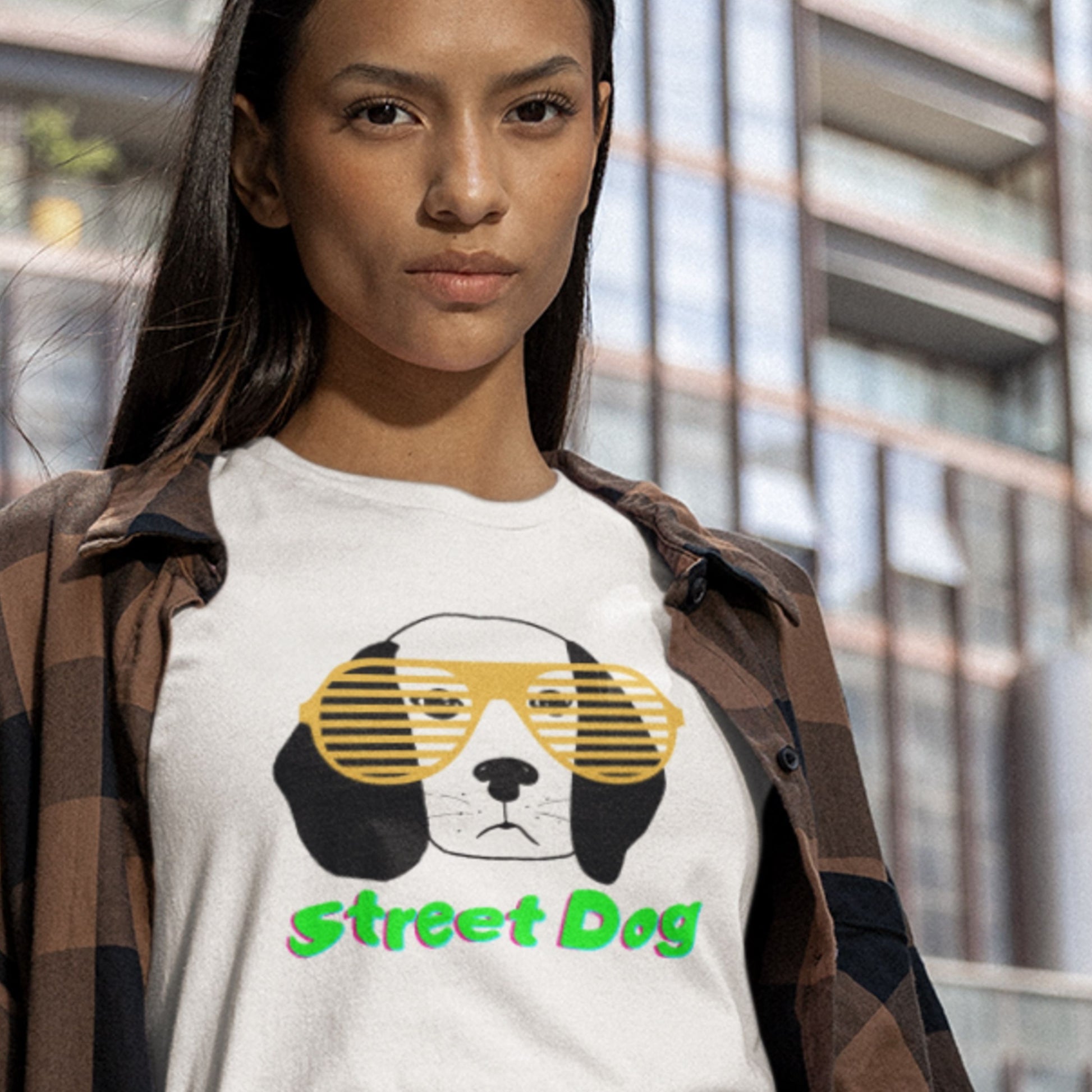 Person wearing a white t-shirt with a dog graphic and 'Street Dog' text, standing outdoors.