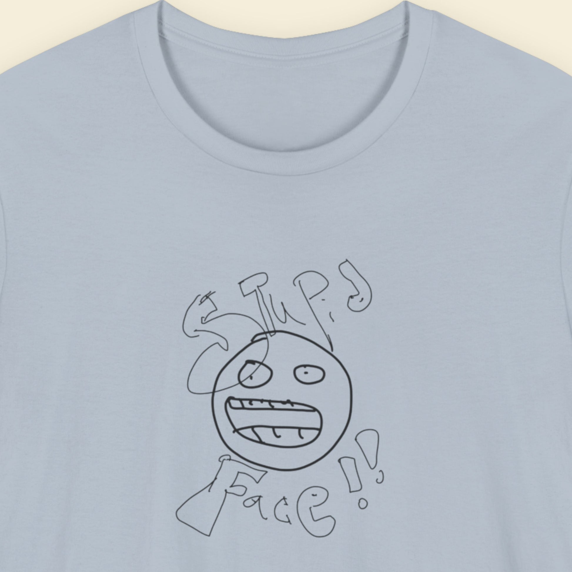 light blue t-shirt with a line drawing and the words 'stupid face' written on it