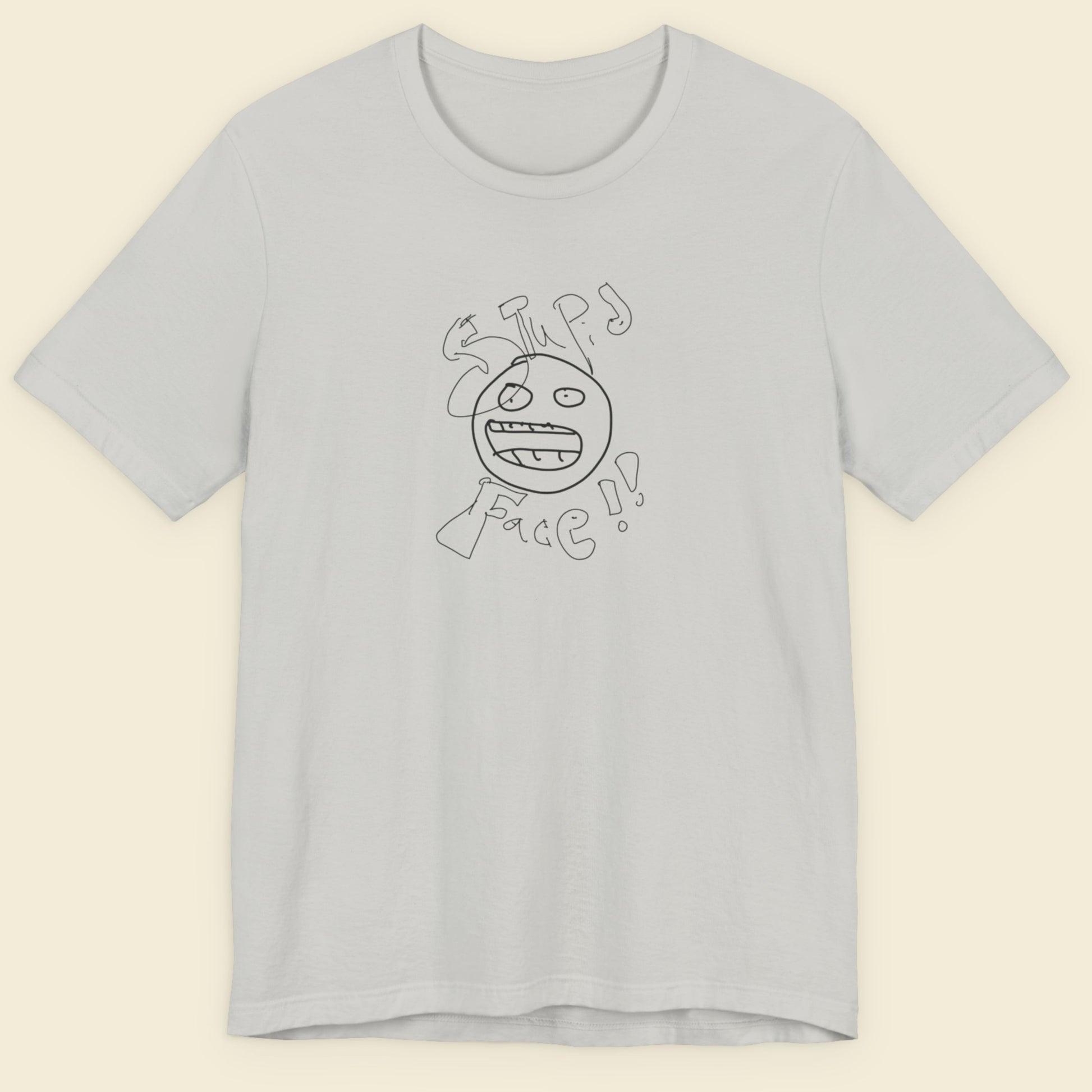 light grey t-shirt with a line drawing and the words 'stupid face' written on it