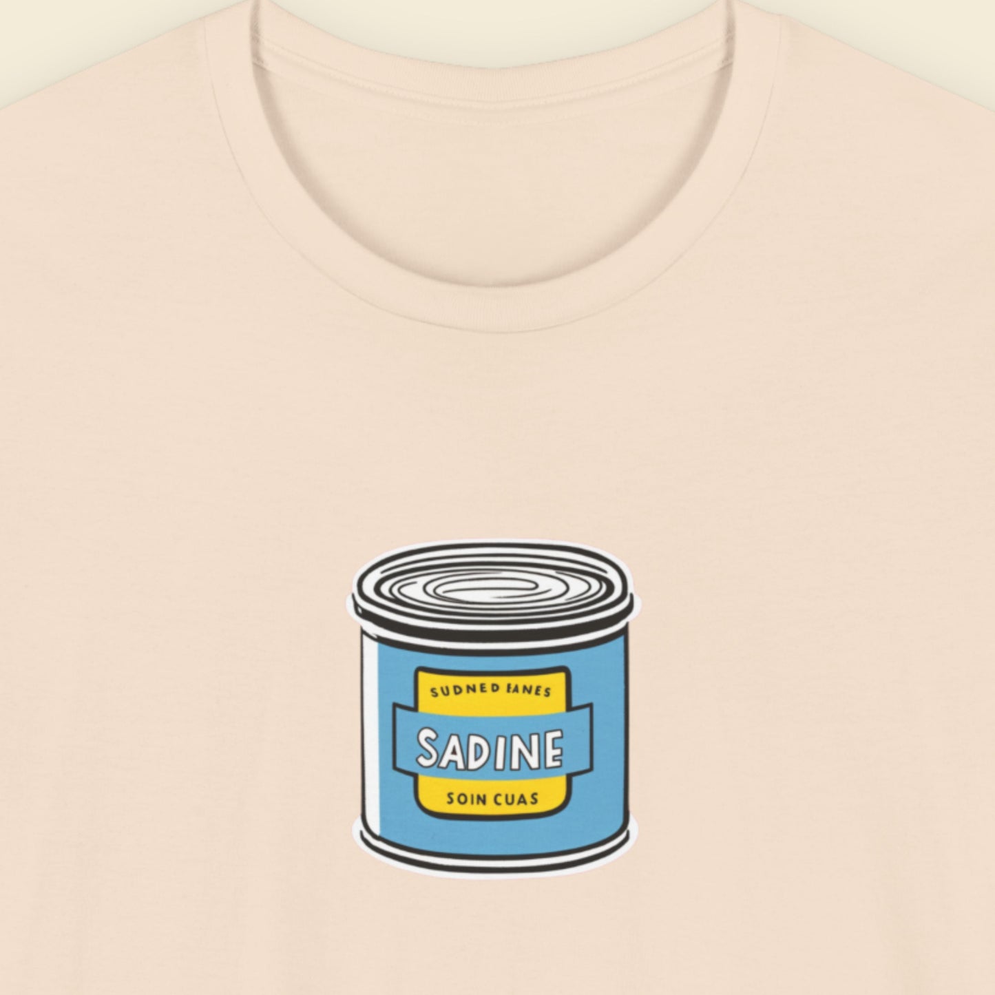 beige shirt with an illustration of a can of fish on a beige background.