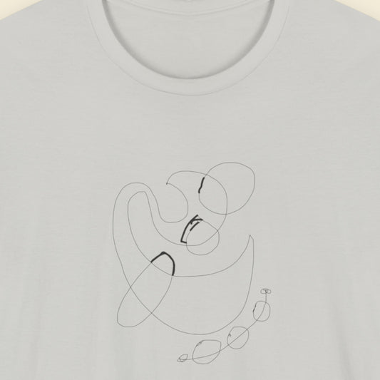 Grey shirt with an abstract black line drawing on a light beige background.