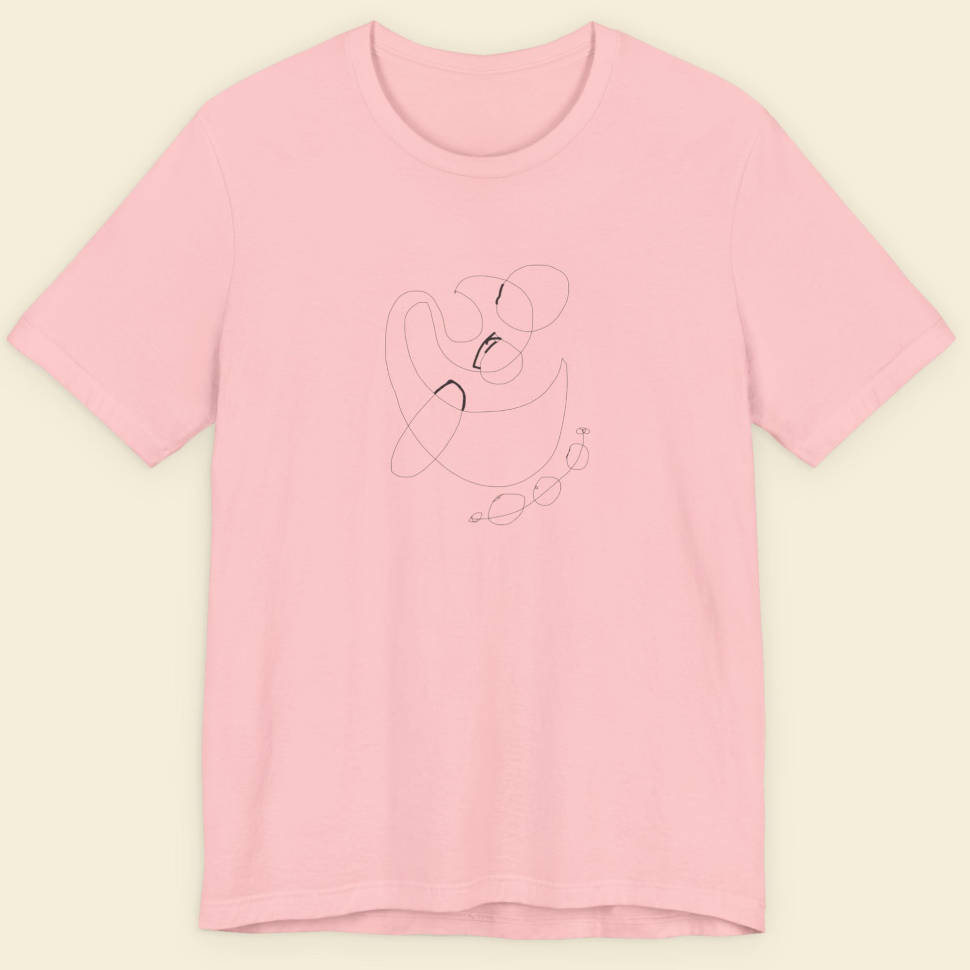 Pink t-shirt with a minimalistic design on a beige background.