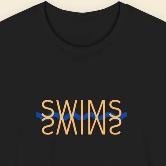 Black t-shirt with humorous colorful text on a beige background.