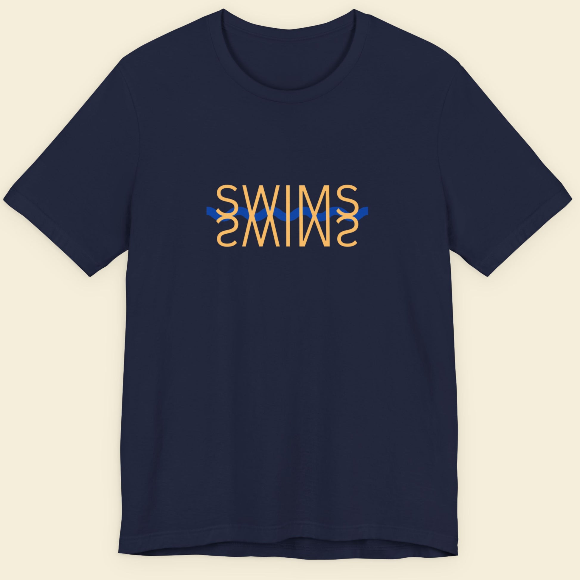 Navy blue t-shirt with humorous colorful text on a beige background.