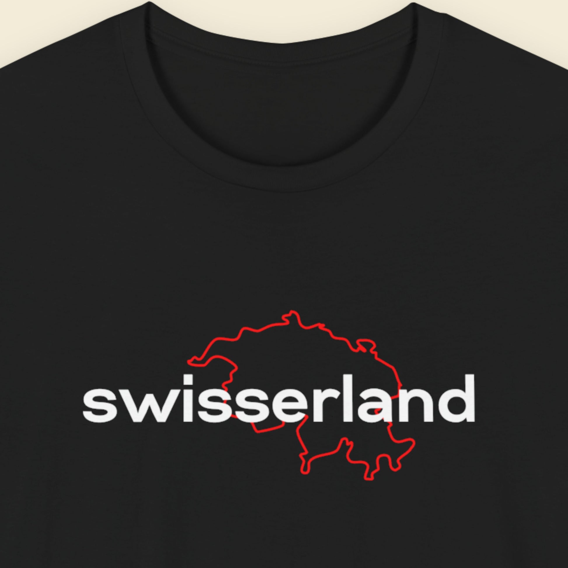 Black t-shirt with humorous text on a beige background.