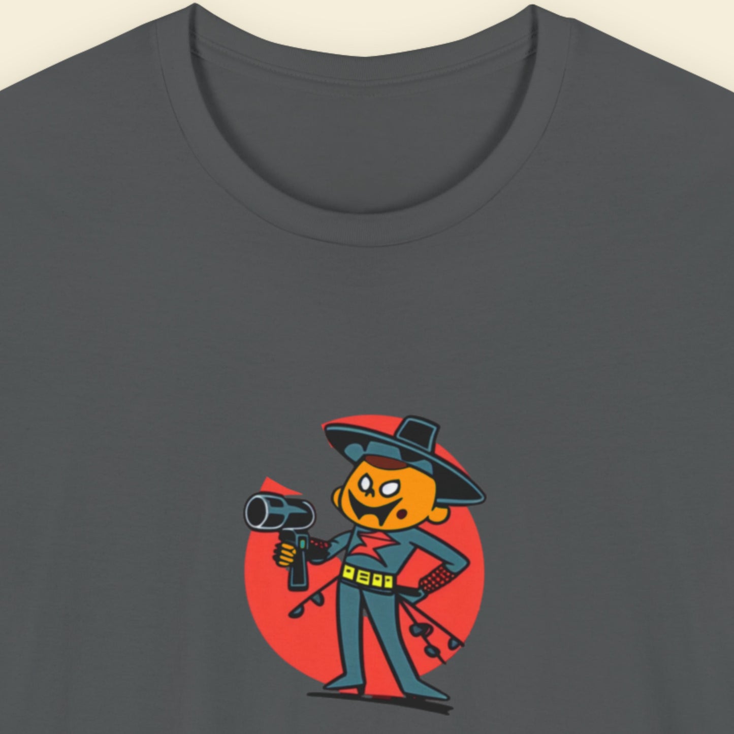 Grey t-shirt with a fun, colorful cartoon hair dresser illustration on a beige background.
