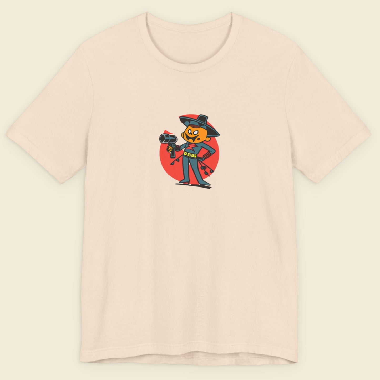 Beige t-shirt with a fun, colorful cartoon hair dresser illustration on a beige background.