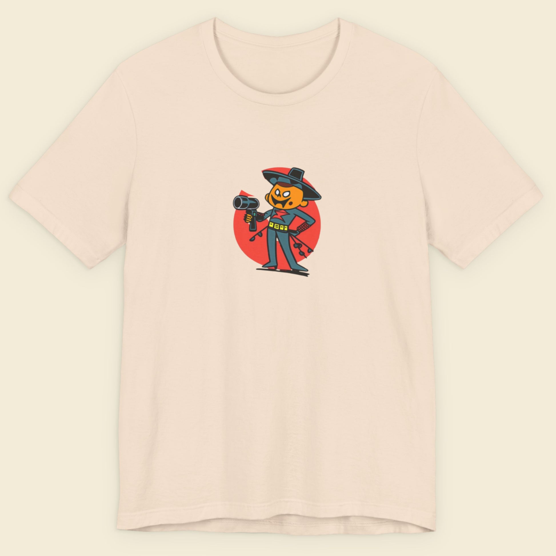 Beige t-shirt with a fun, colorful cartoon hair dresser illustration on a beige background.