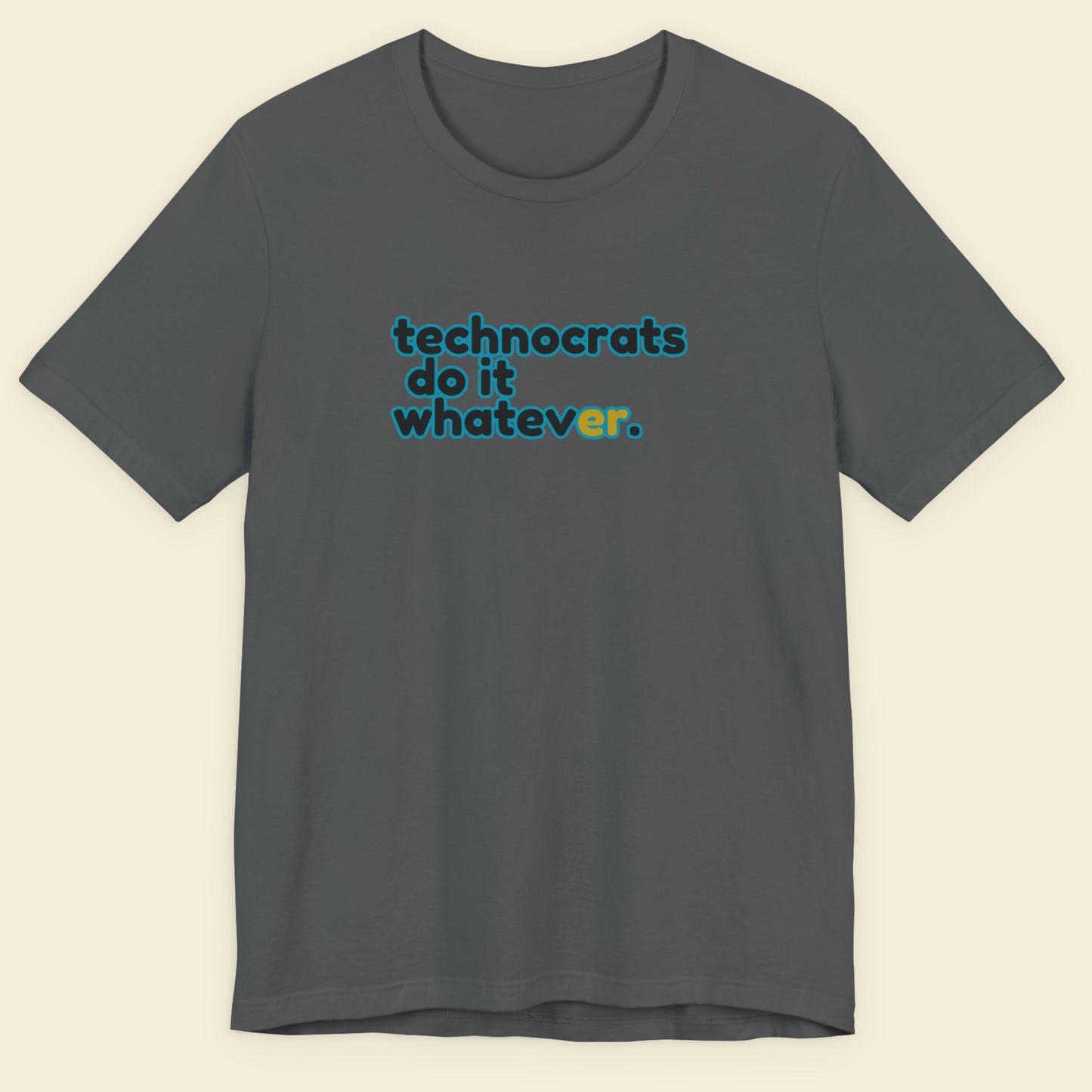 Grey tee with multicolored 'technocrats do it whatever' text on a beige background.