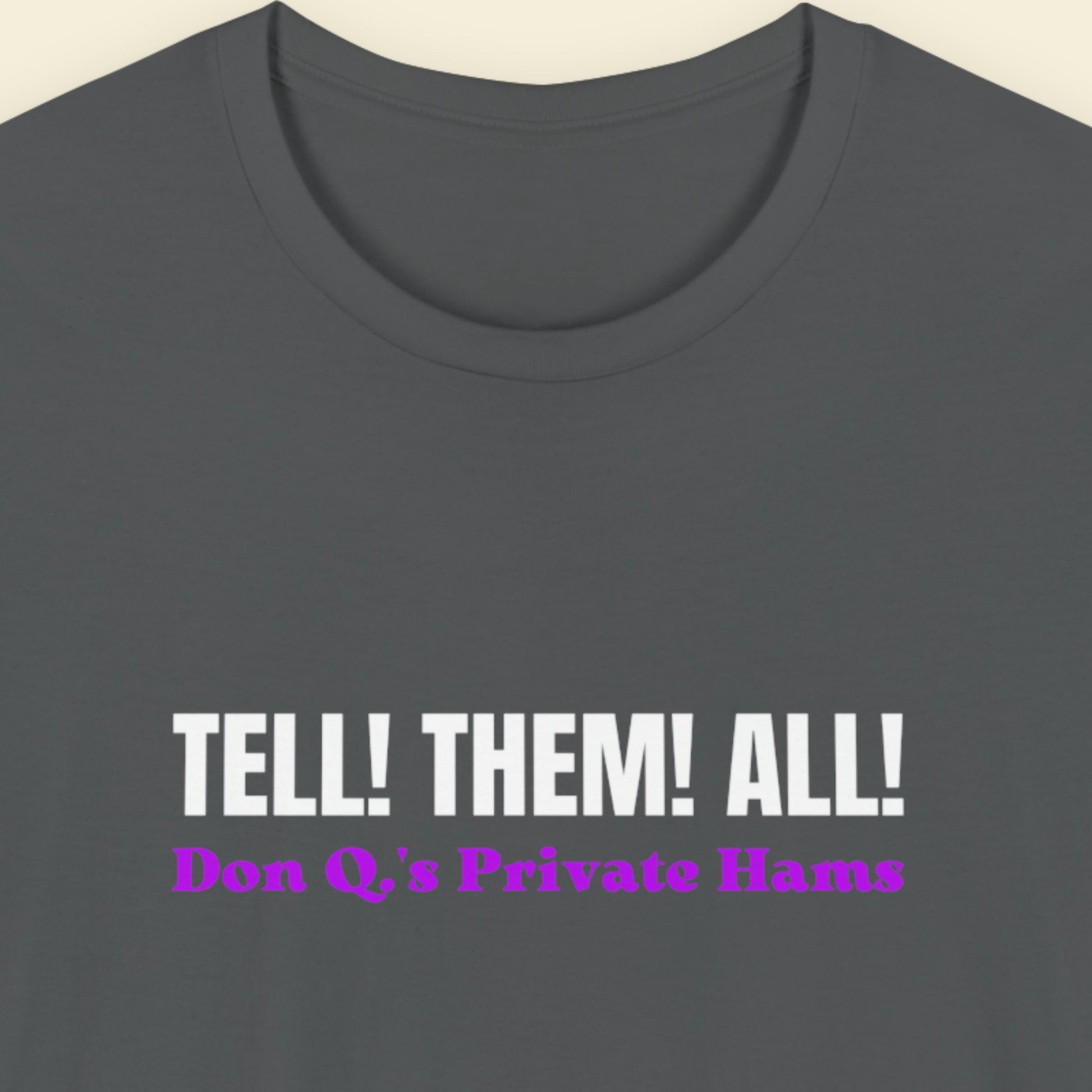 Gray t-shirt with text 'TELL! THEM! ALL! Don Q's Private Hams' on a beige background.