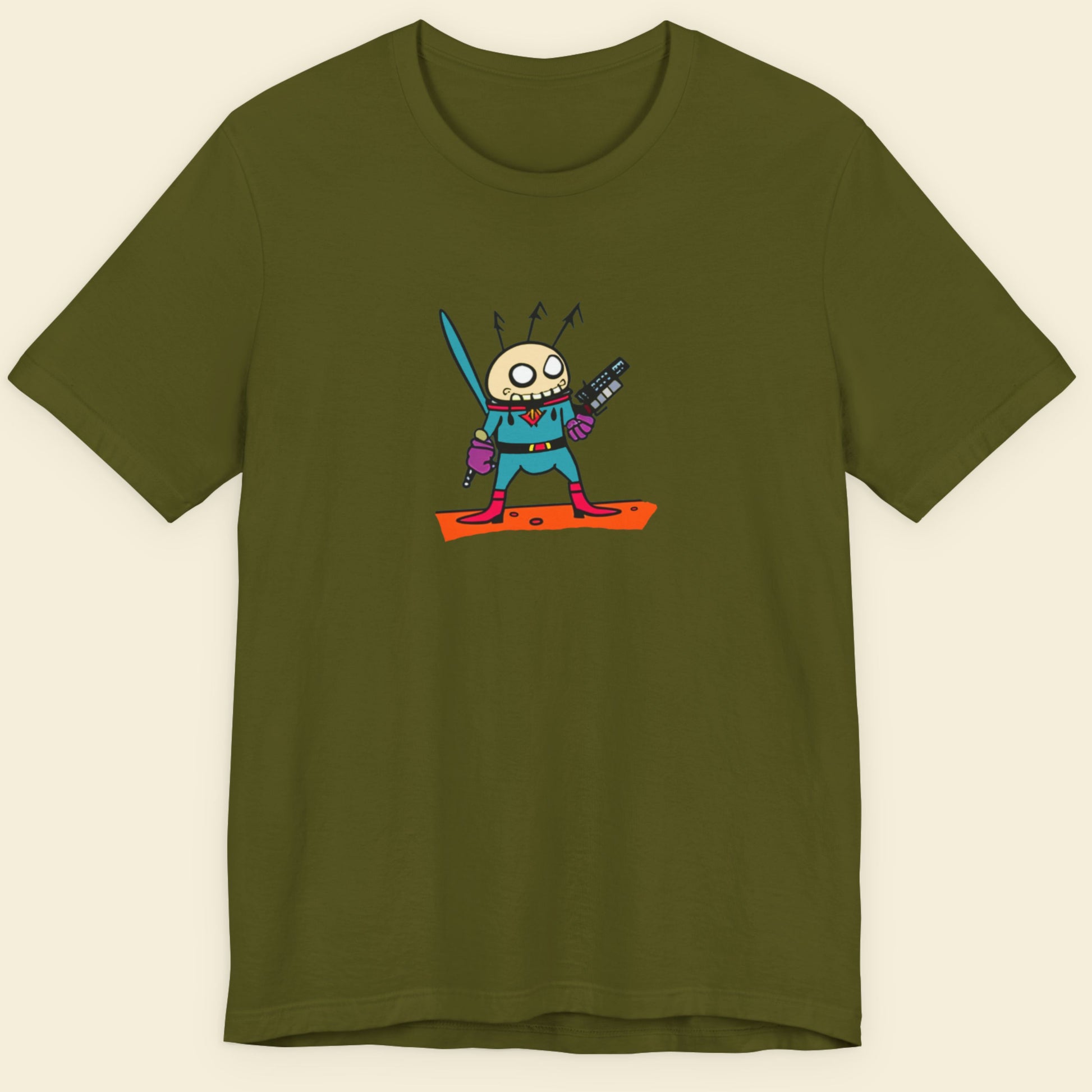 Green t-shirt with a fun, colorful cartoon alien illustration on a beige background.