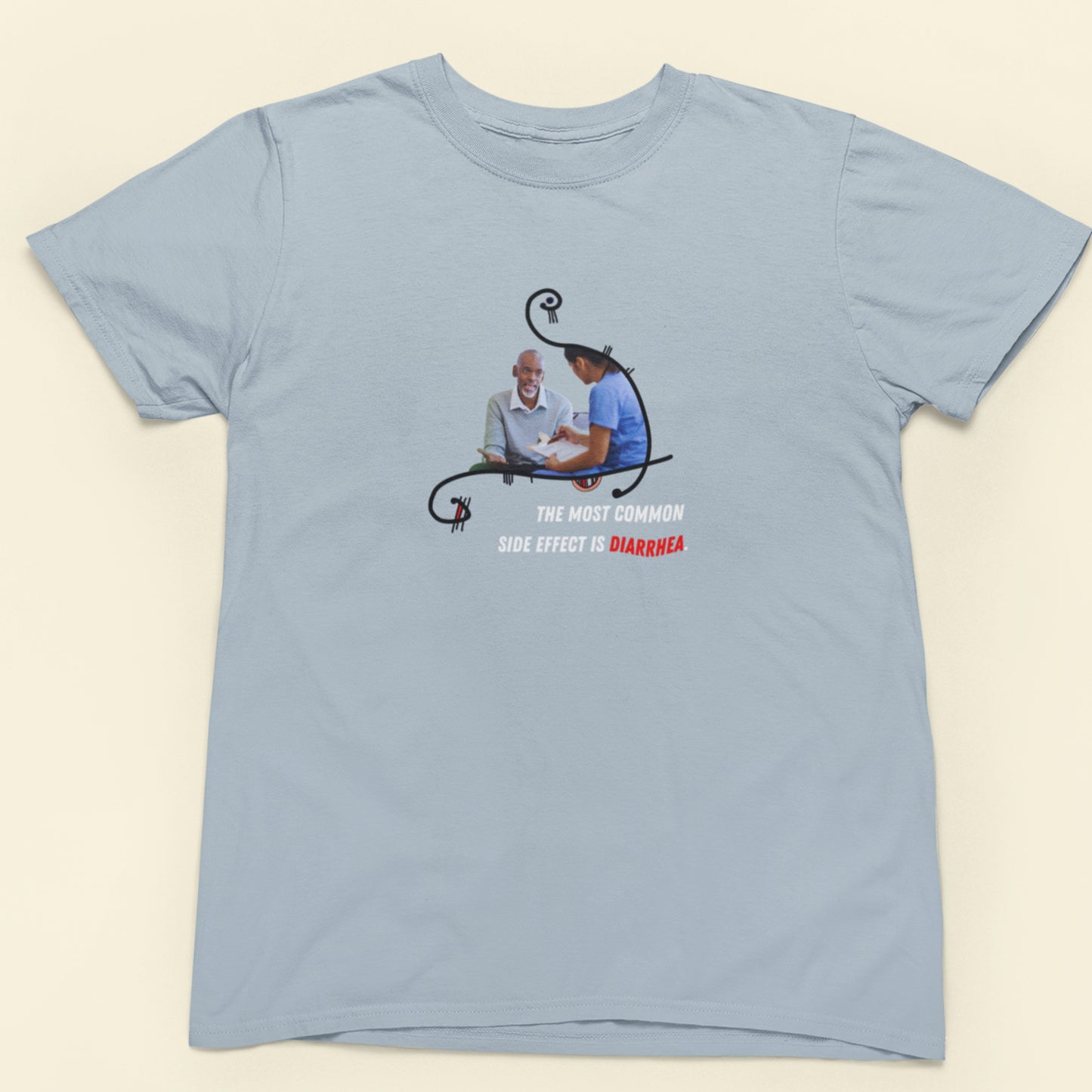 Light blue t-shirt with a graphic design on a beige background
