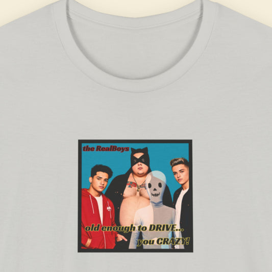 Light grey t-shirt featuring a graphic of the debut album from the RealBoys on a beige background.