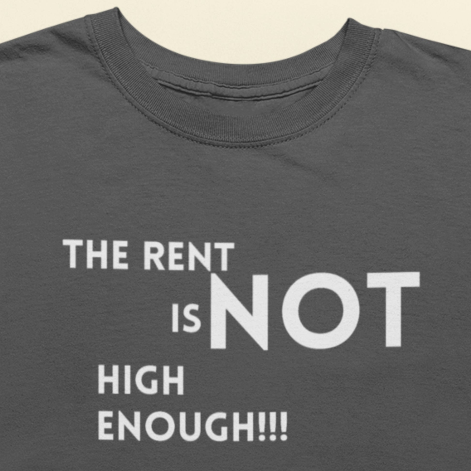 Gray t-shirt with white text 'THE RENT IS NOT HIGH ENOUGH!!!'