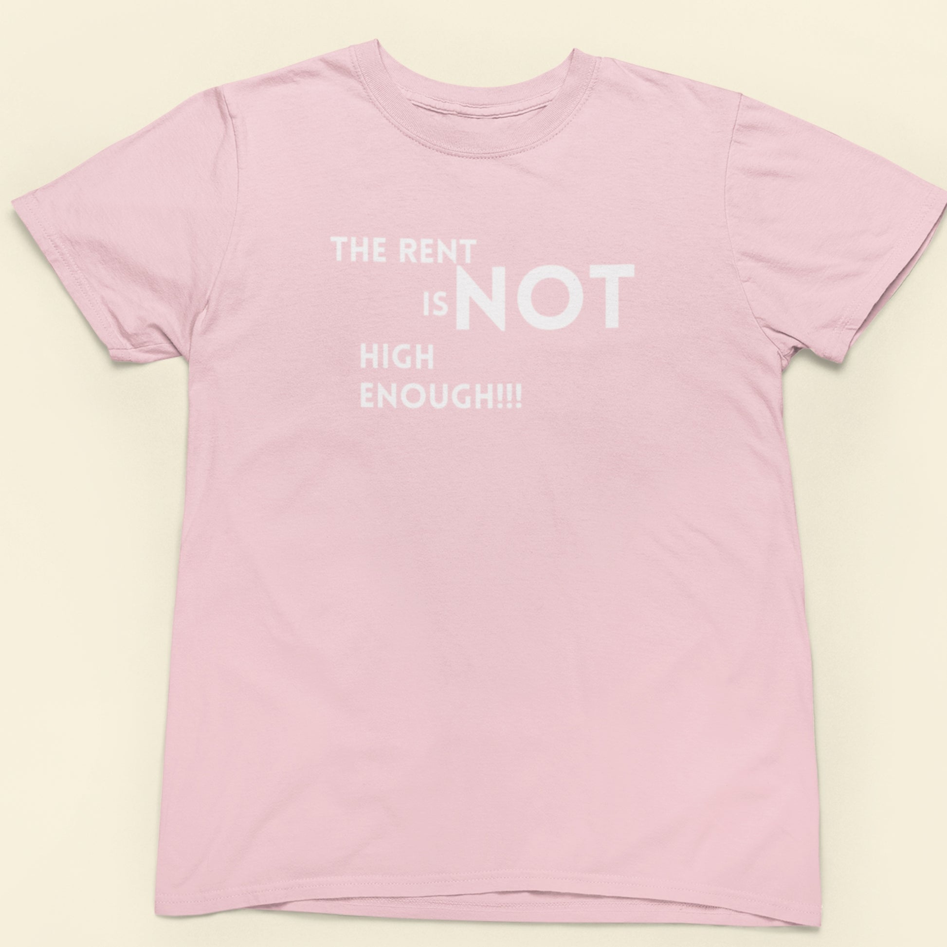 Pink t-shirt with white text on a beige background