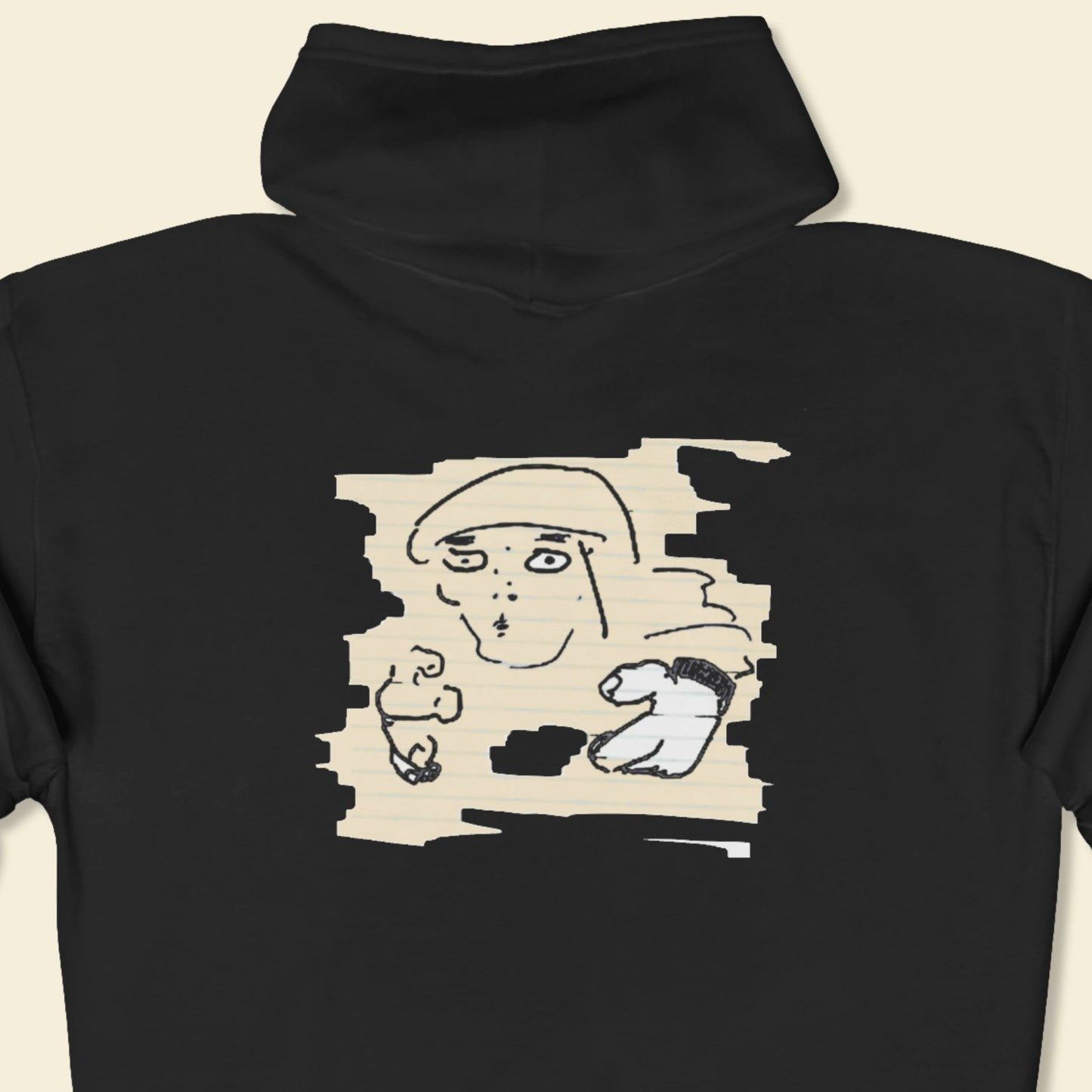 Black t-shirt with a graphic design of a person on a beige background.