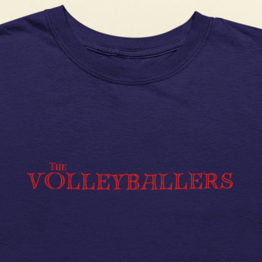 Navy blue shirt with 'The Volleyballers' text in red on a beige background