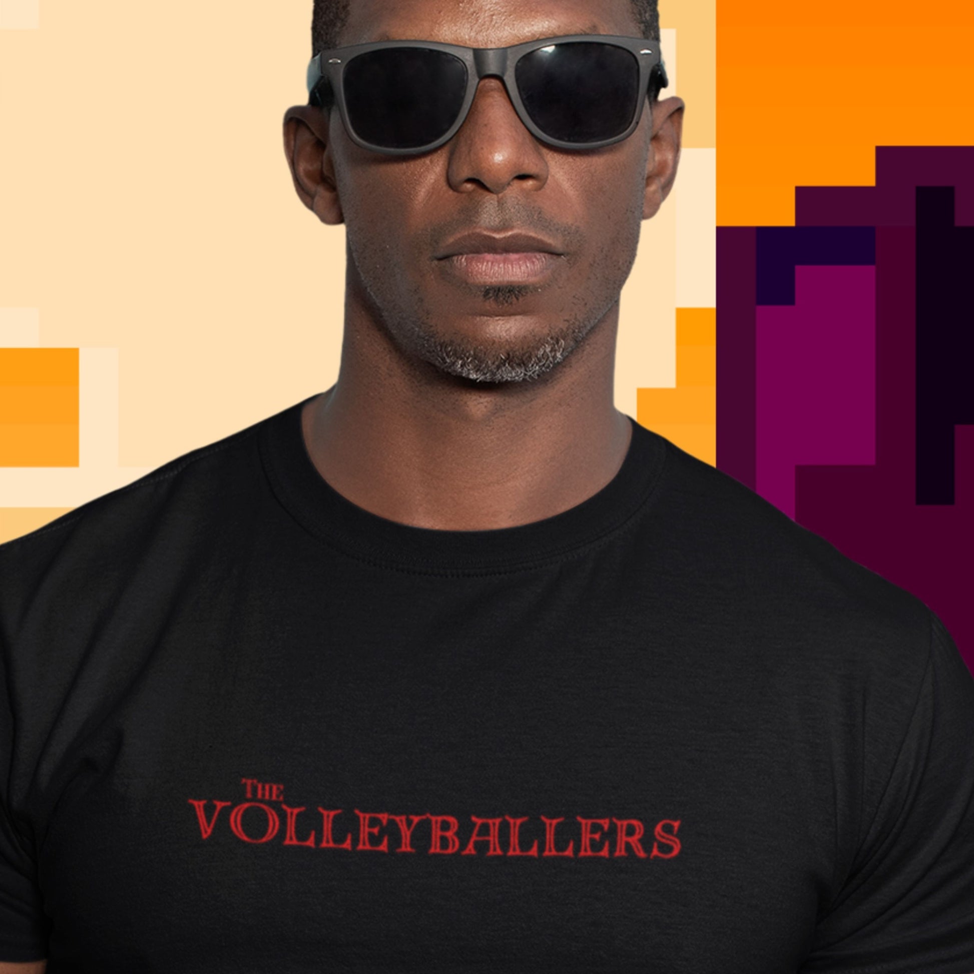 Man wearing a black t-shirt with 'The Volleyballers' text against a colorful geometric background
