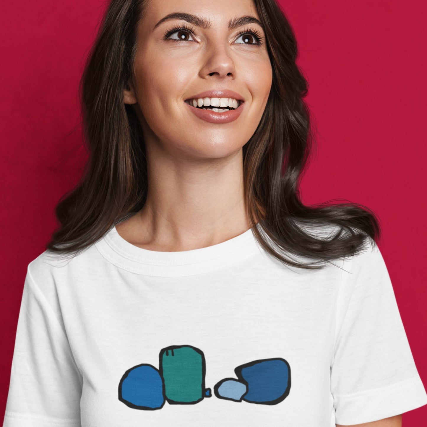Woman wearing a white t-shirt with blue graphic design on a red background.