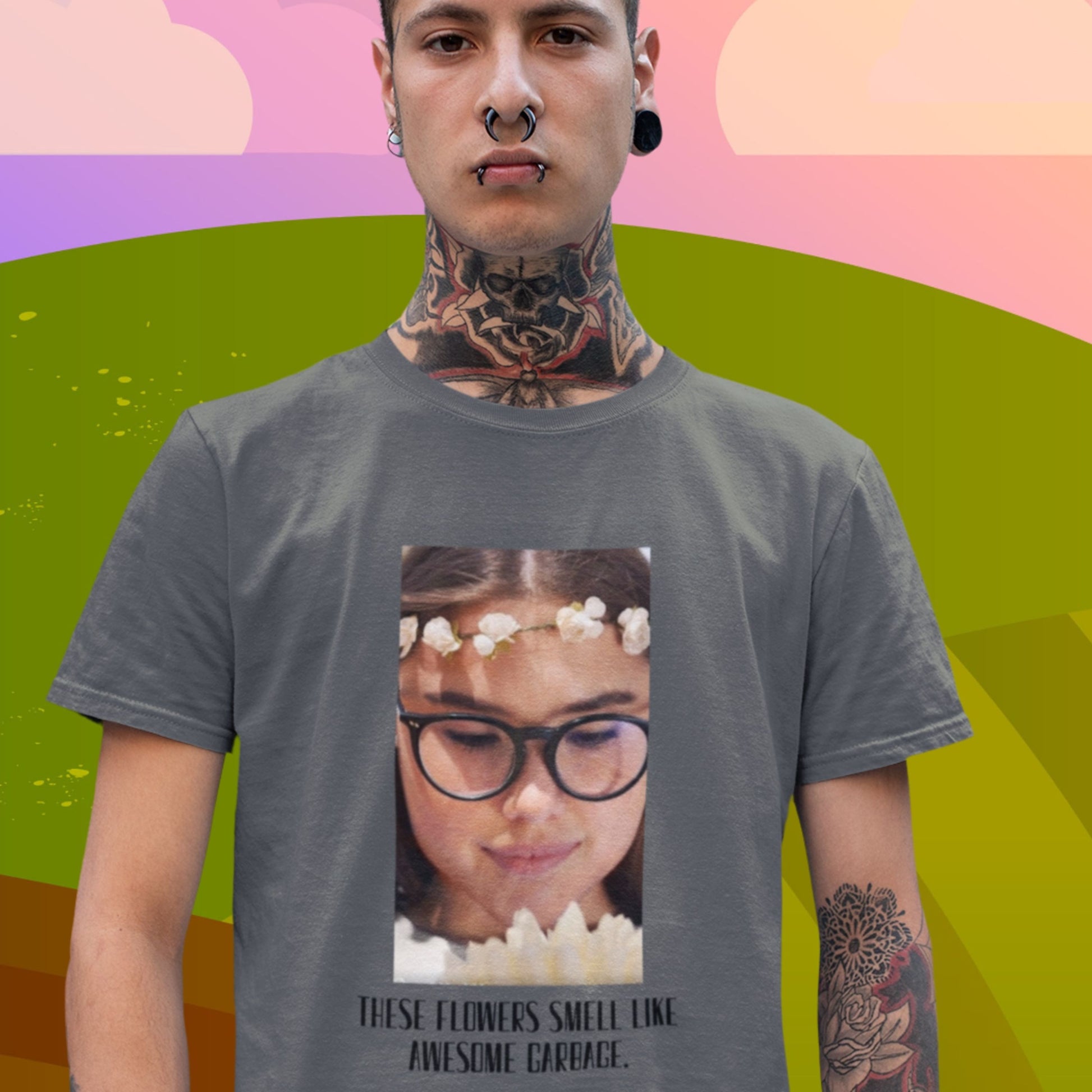 Person wearing a t-shirt with a graphic design on a colorful background.