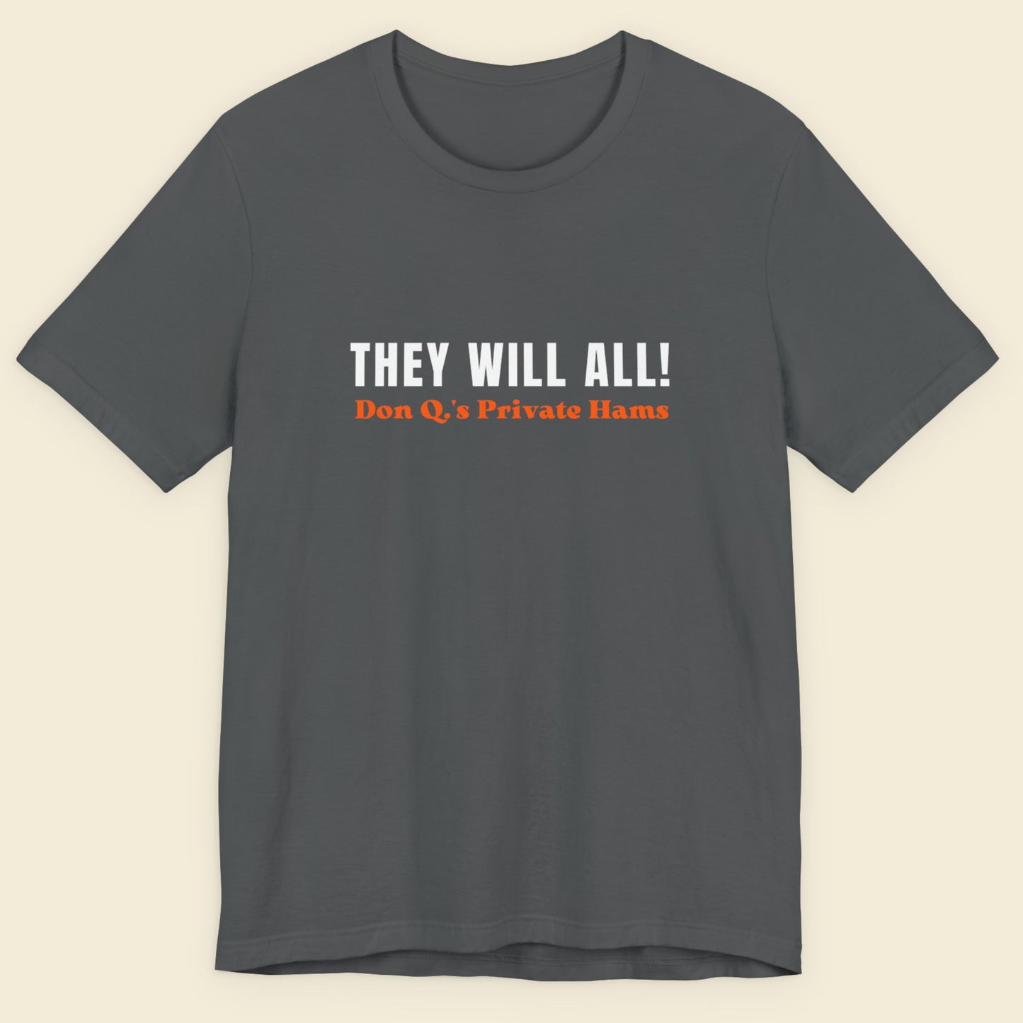 Gray t-shirt with text 'THEY WILL ALL! Don Q's Private Hams' on a beige background.