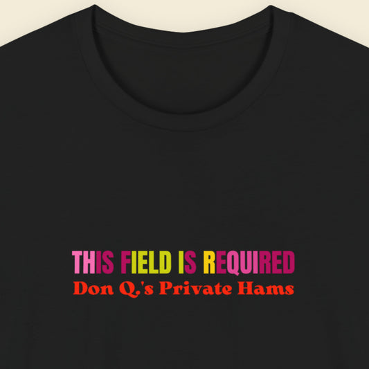 Black t-shirt with nonsensical, multicolored text on a beige background.