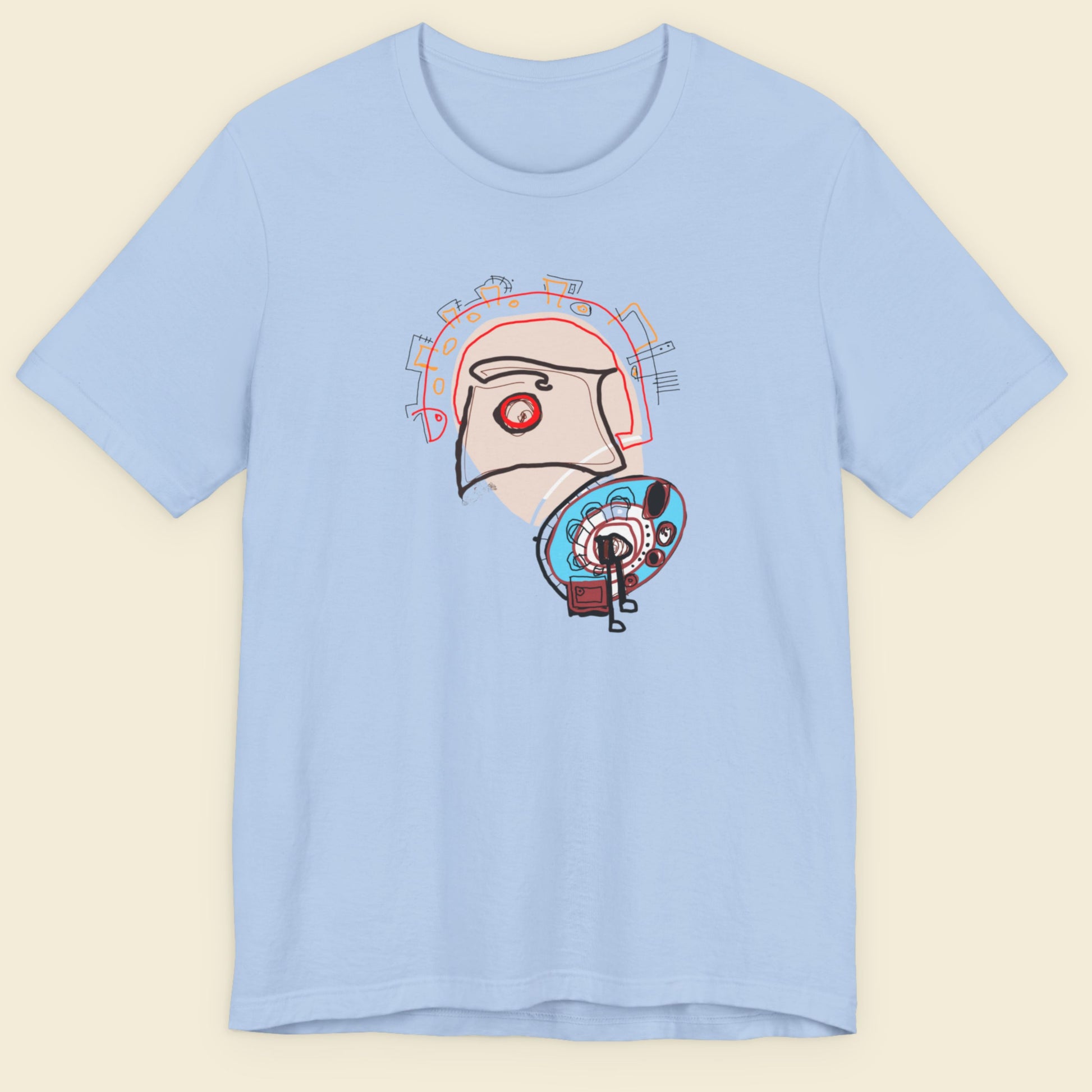 Light blue t-shirt with a graphic design on a beige background.
