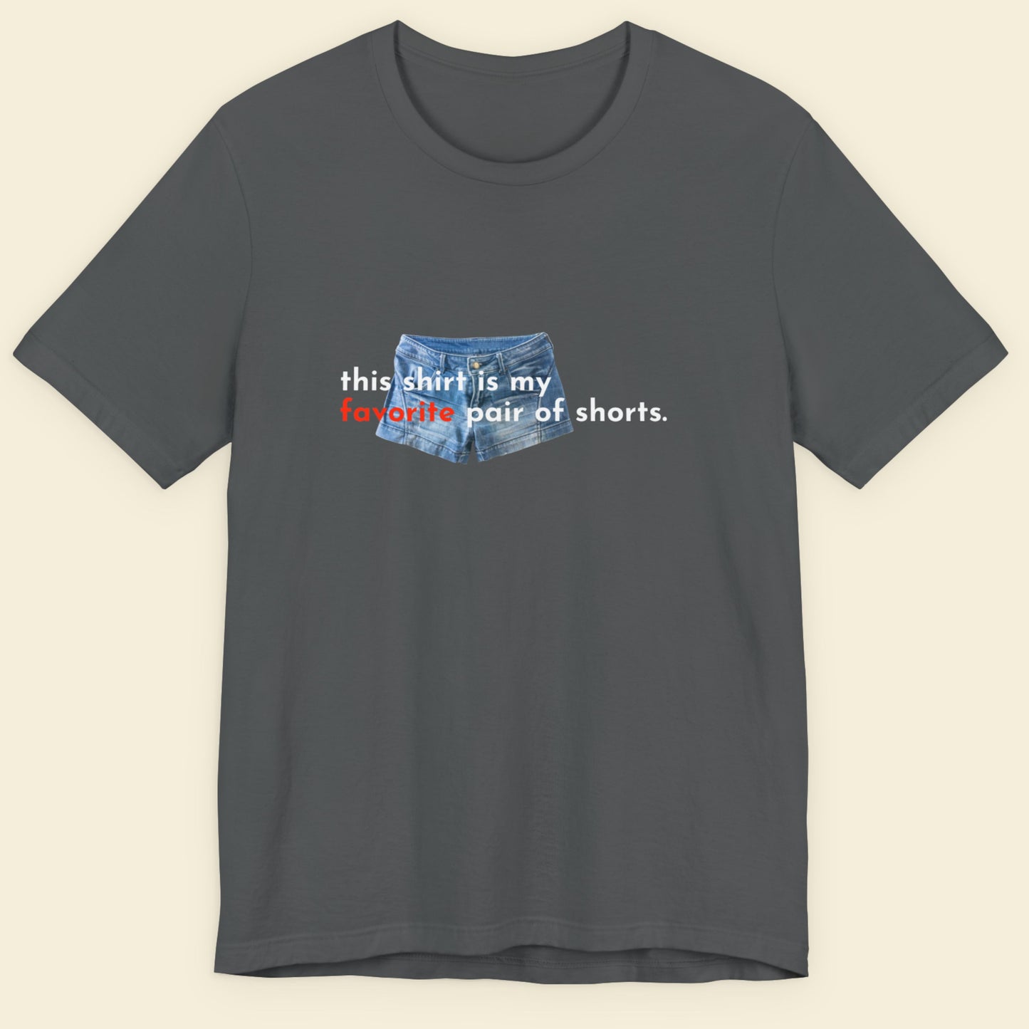 Gray t-shirt with graphic of denim shorts and text on a beige background.