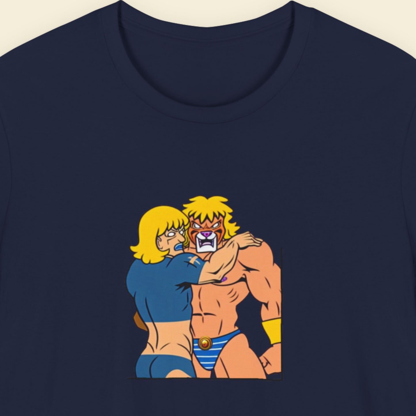 Navy blue t-shirt with a fun, colorful cartoon illustration on a beige background.