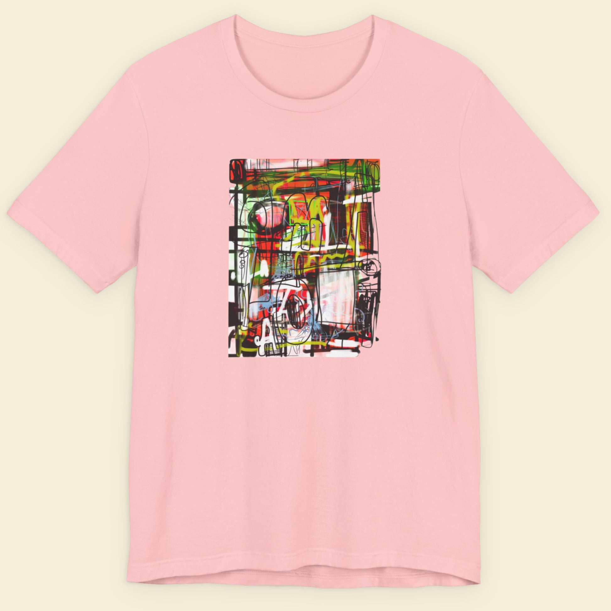 Pink t-shirt with a colorful abstract drawing on a beige background.