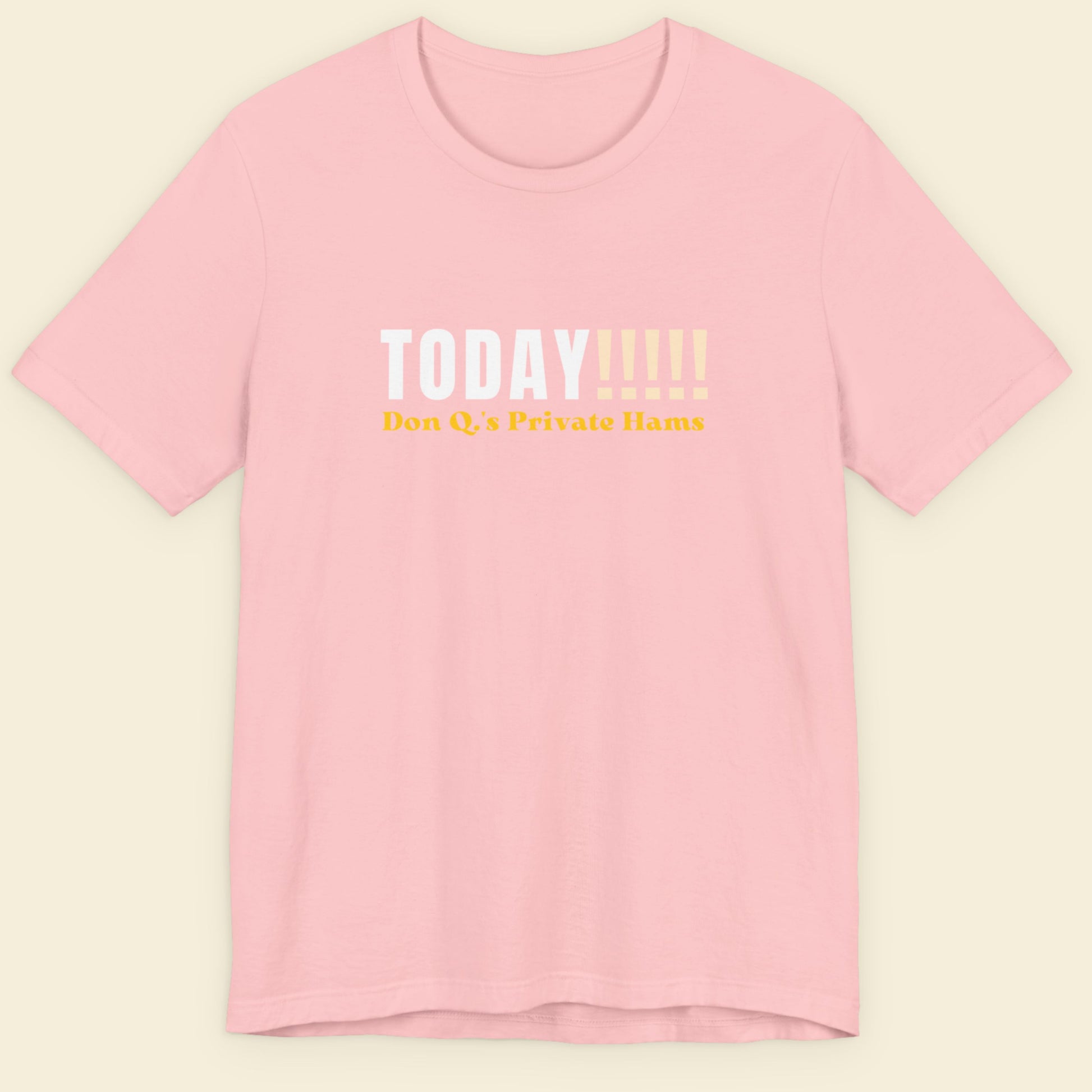 Pink t-shirt with text on a beige background.