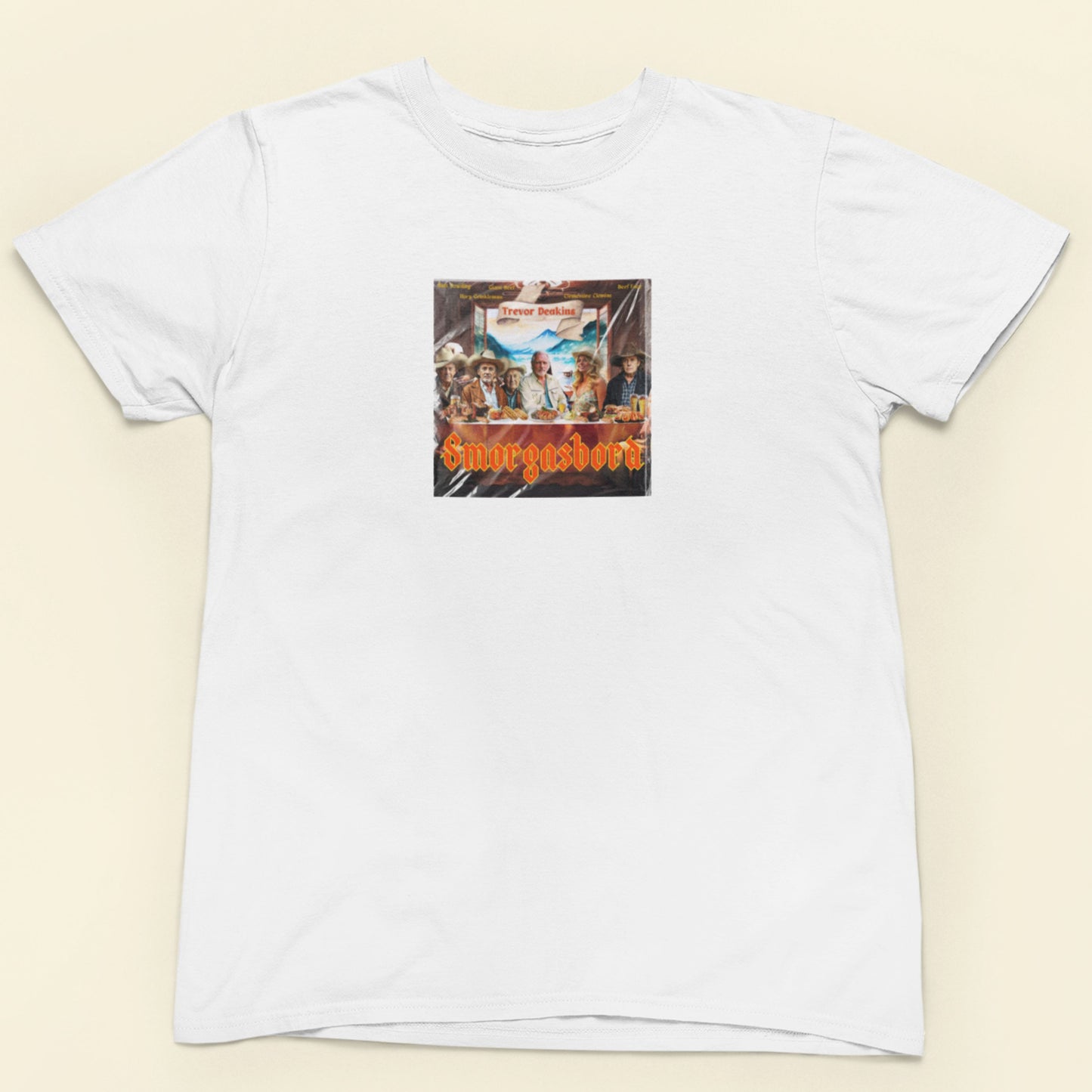 White t-shirt with a graphic design on a beige background.