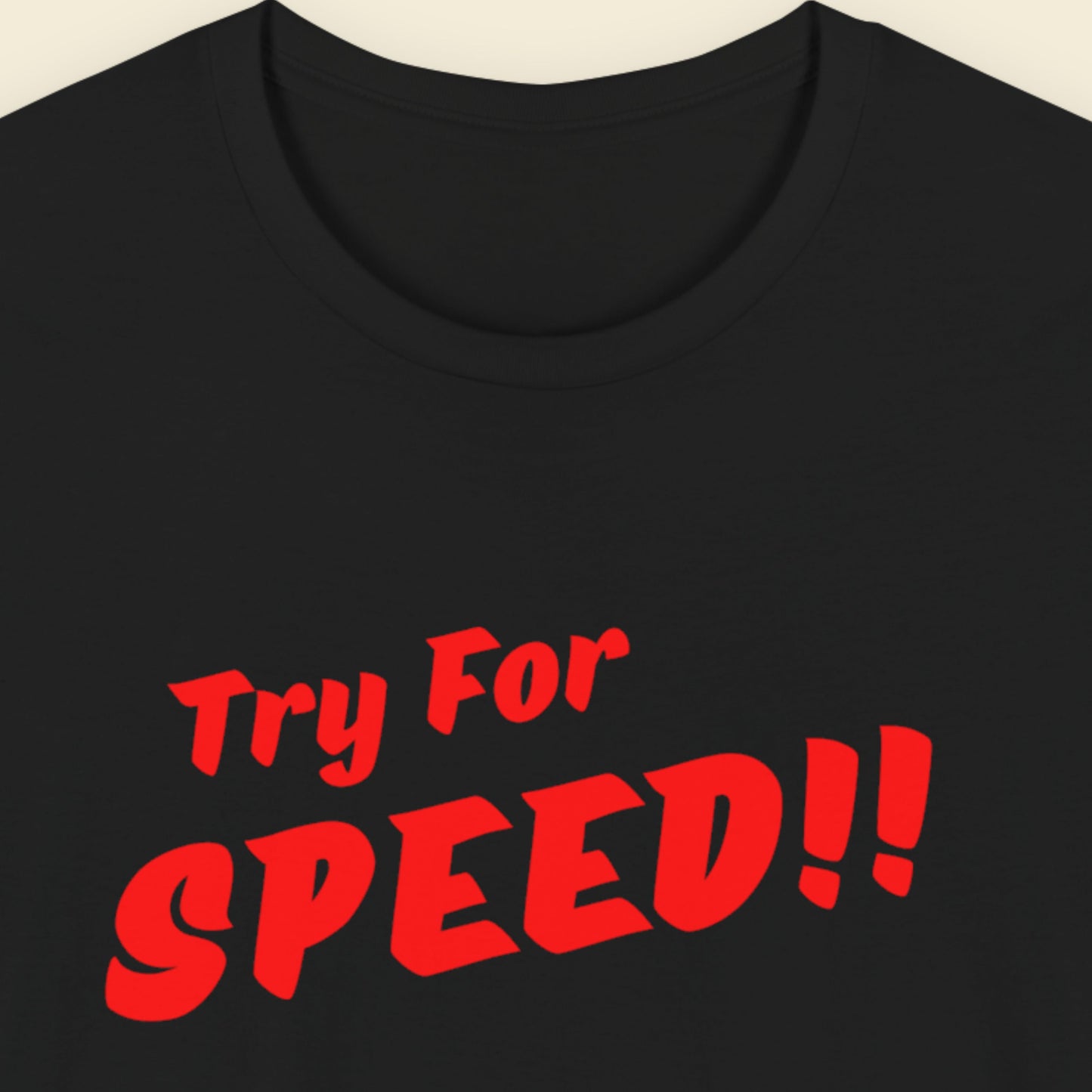 Black t-shirt with red text 'Try For SPEED!!' on a beige background.