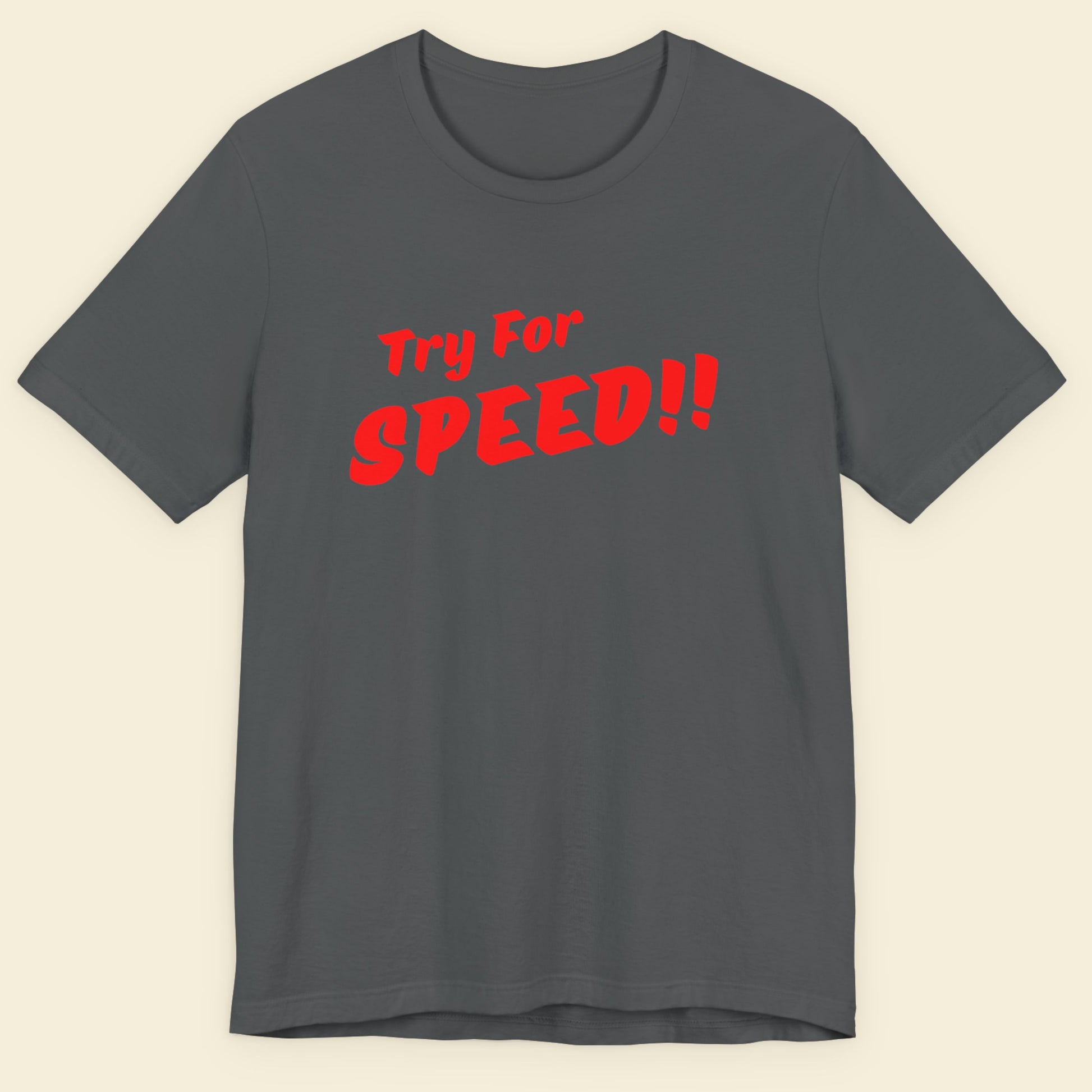 Gray t-shirt with red text 'Try For SPEED!!' on a beige background.