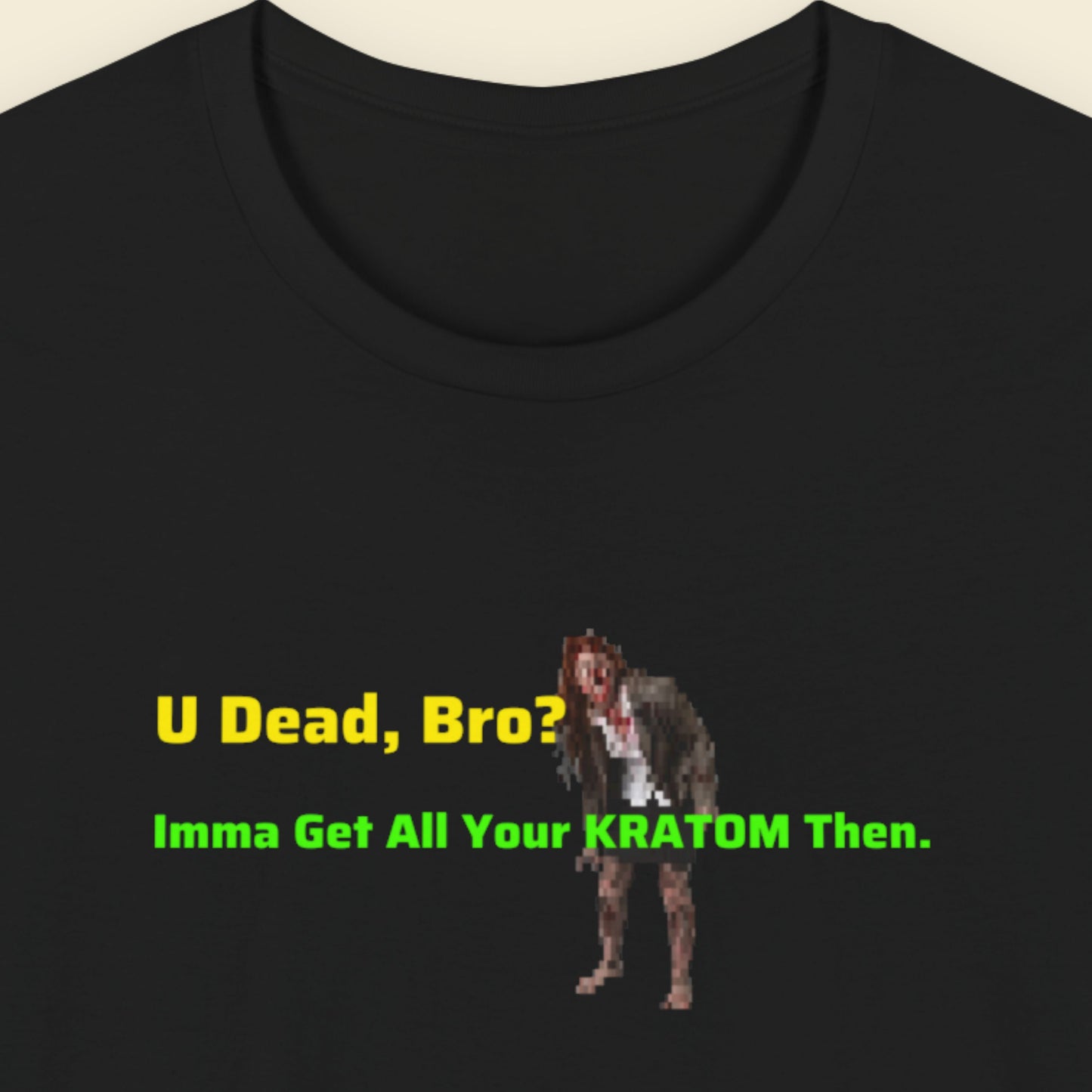 Black t-shirt with pixelated graphic and text on a beige background.
