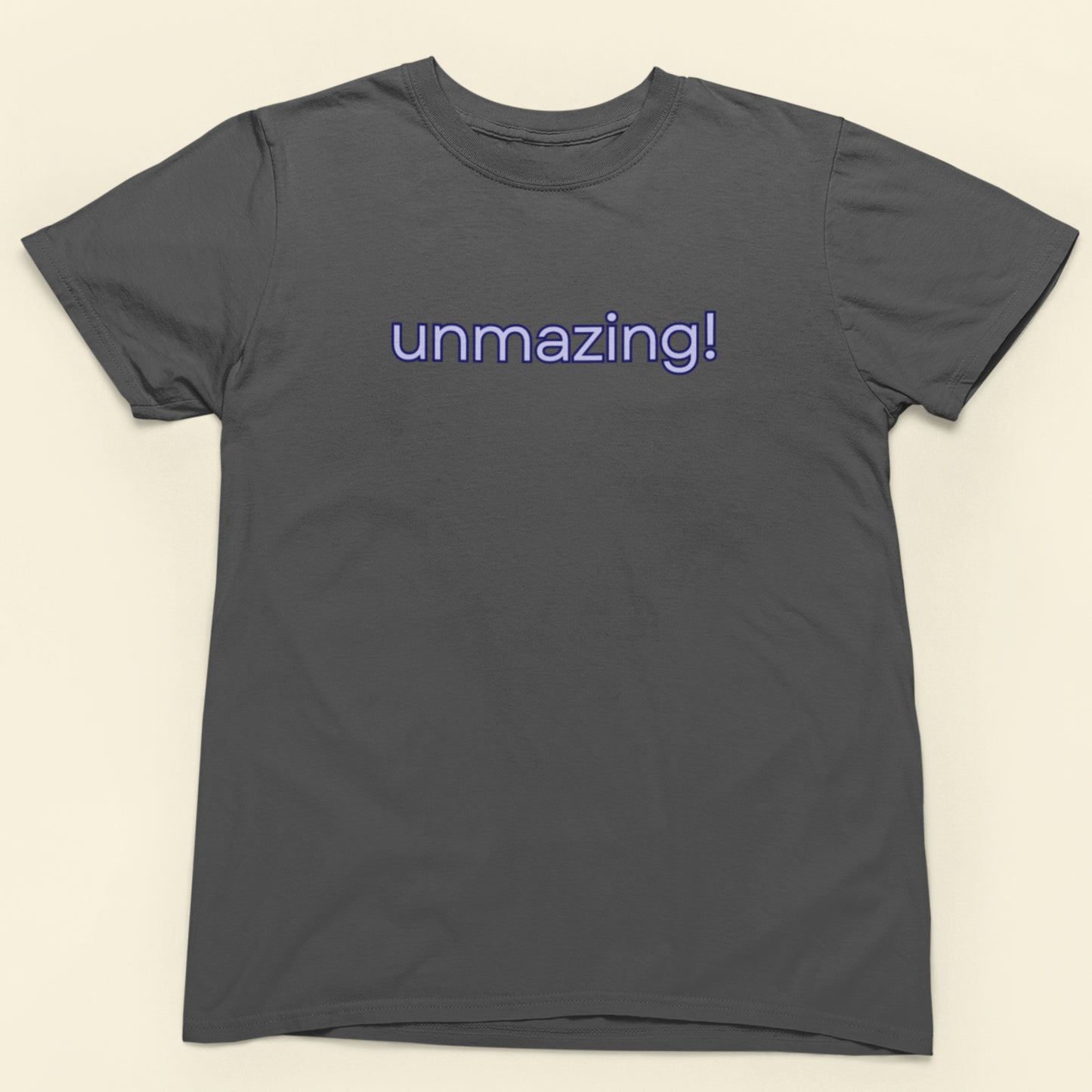 Gray t-shirt with 'unmazing!' text on a beige background