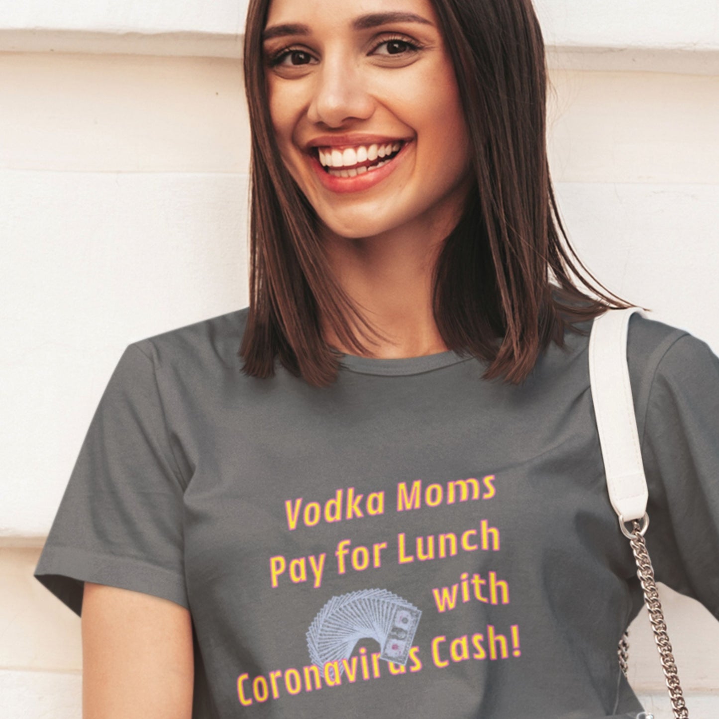 Woman wearing a gray t-shirt with humorous text design.