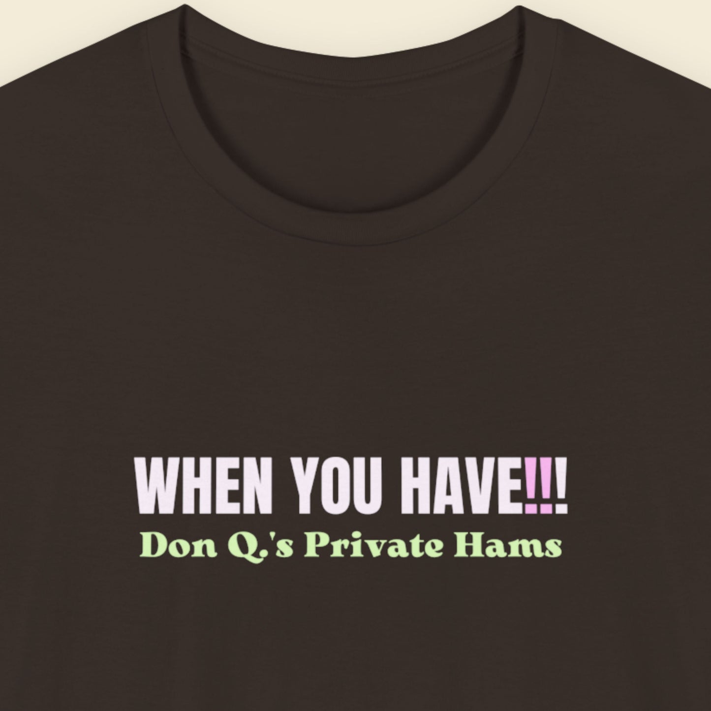 Brown t-shirt with colorful nonsensical text on a beige background.