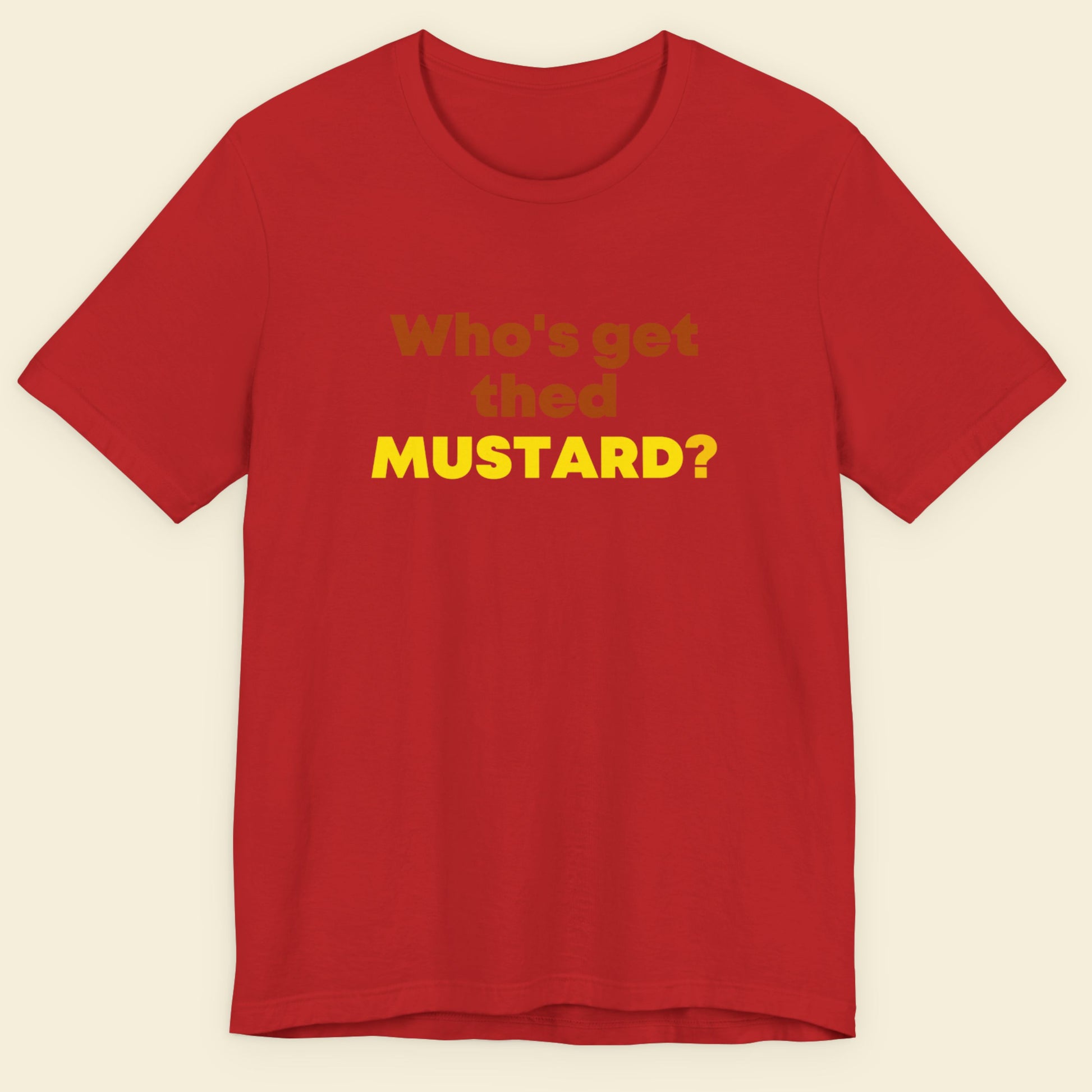 Red t-shirt with yellow text on a beige background.