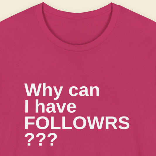 Pink t-shirt with white text 'Why can I have FOLLOWRS ???' on a beige background.
