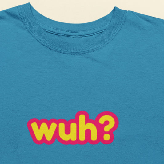 Blue t-shirt with 'wuh?' text in yellow and pink on a beige background