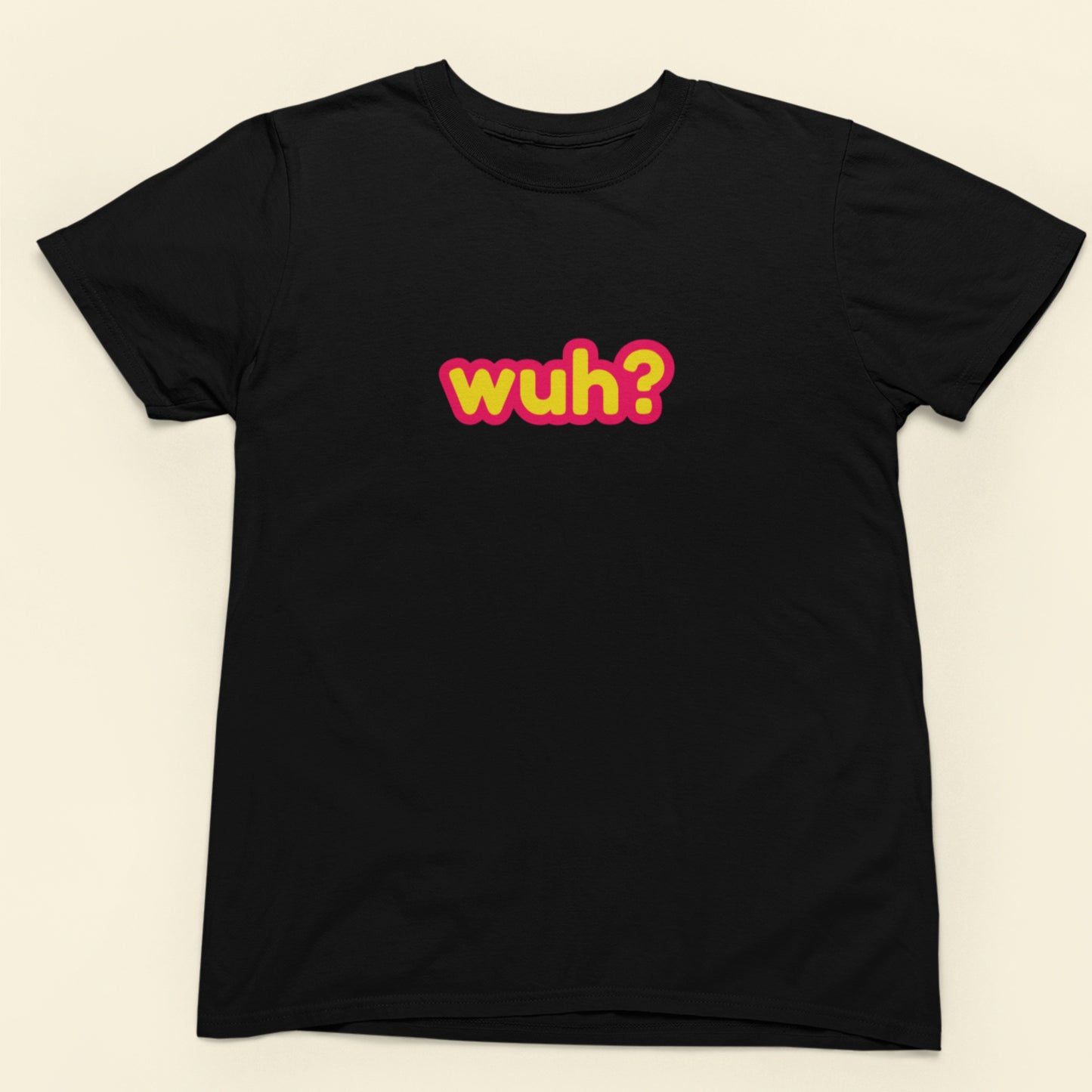 Black t-shirt with colorful text 'wuh?' on a beige background