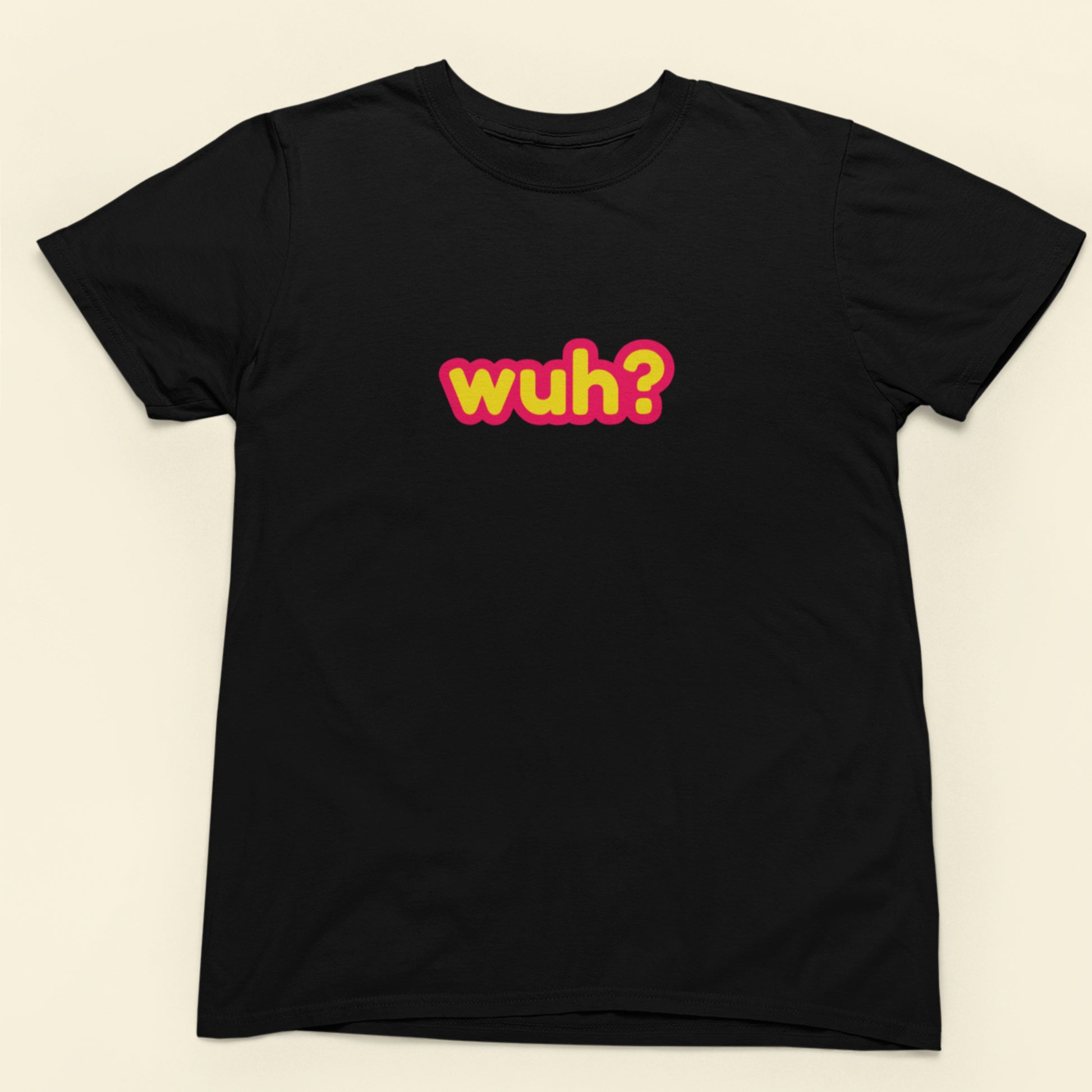 Black t-shirt with colorful text 'wuh?' on a beige background