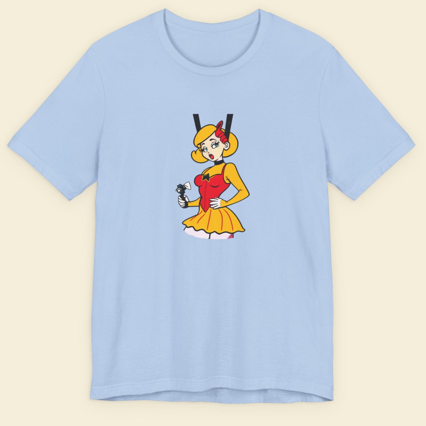 Baby blue t-shirt with a fun, colorful cartoon illustration on a beige background.