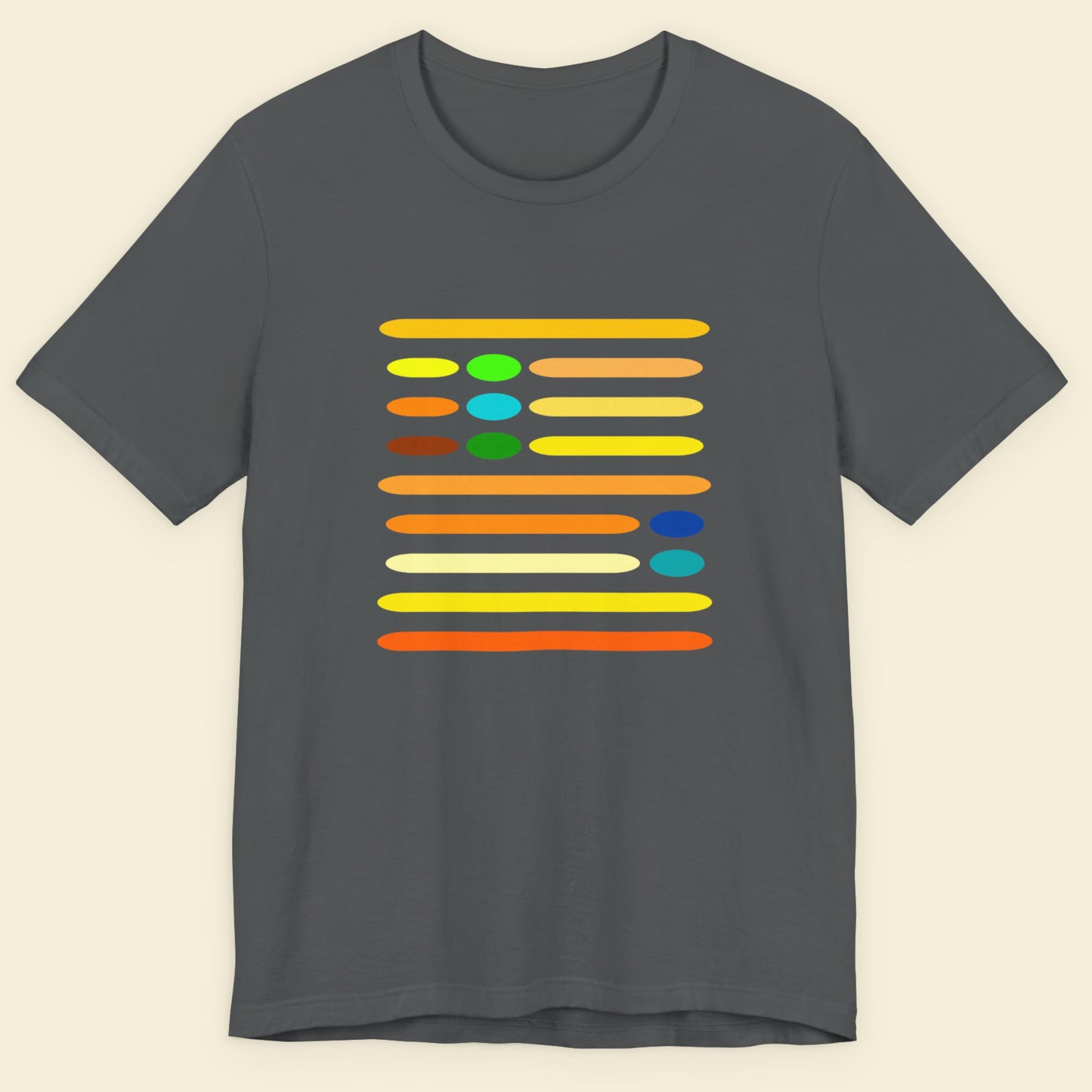 Gray t-shirt with colorful design on a beige background.