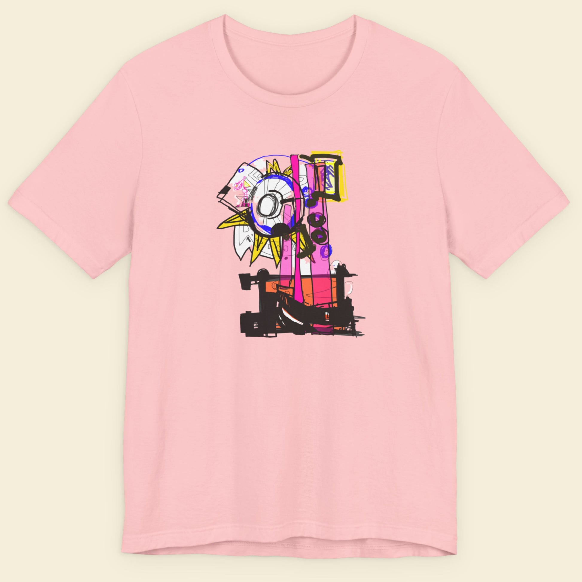 Pink t-shirt with a colorful graphic design on a beige background.