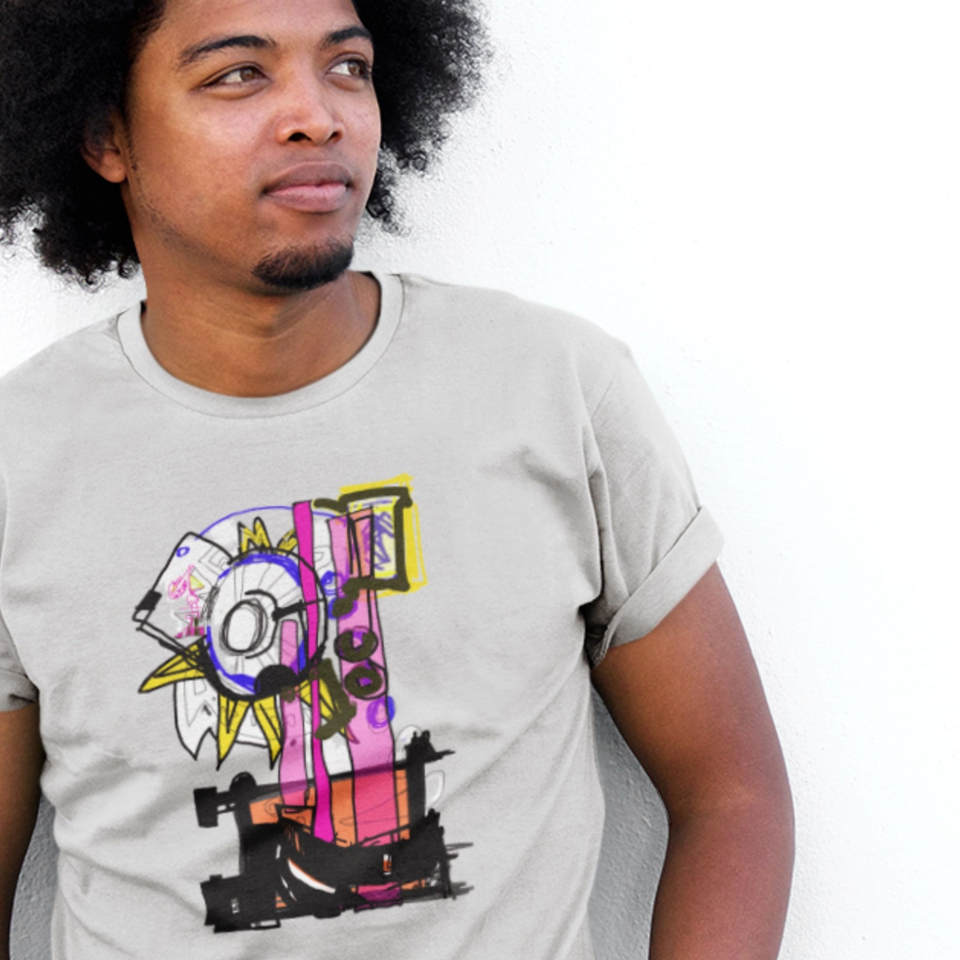 Person wearing a light gray t-shirt with colorful graphic design on a white background.